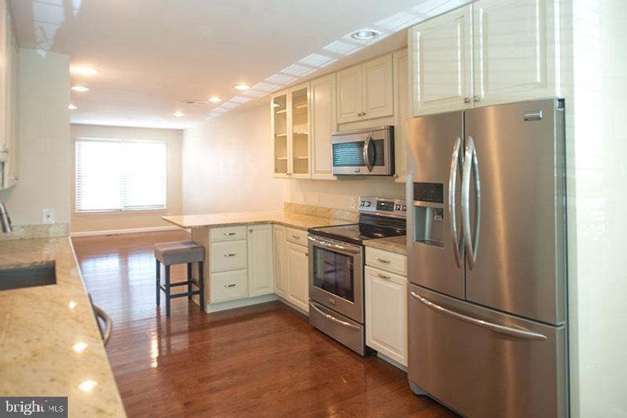 Completely updated 3 bedroom 3 full bath home! Main level includes kitchen w/SS appliances, 42" cabinets, granite counter tops, half bath, dining area and over-sized living room.  Three bedrooms on upper level with gorgeous master bathroom w/ walk-in shower, updated hall bath and two generously sized secondary bedrooms. Spacious lower level includes custom bar with wine fridge, family room, 3rd full bath, large laundry area.  Enjoy your private brick patio !