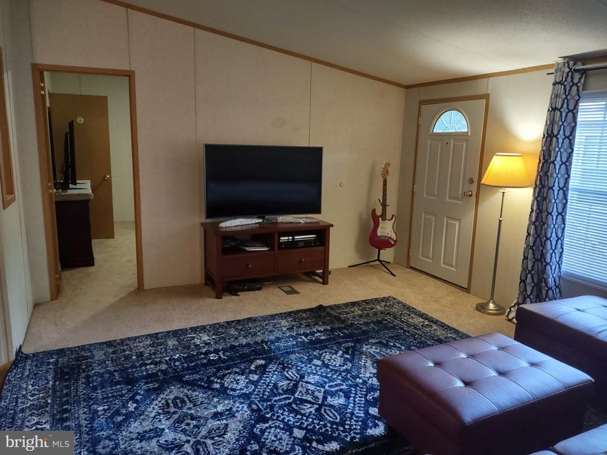 Great Space in this Very Wide Mobile home. Please take your shoes off inside the house (the owners do). This home has a Living room, and another spacious Family room, which is very rare. Very large kitchen with pantry and dining room. All three bedrooms have walk in closets!  The fenced in back yard is great for small children and pets. The owners are also willing to sell any of the furnishings for a reasonable offer (separate from the home purchase).  Easy access to Washington DC, Virginia, Annapolis, Upper Marlboro, Chesapeake Bay, Andrews, Fort Meade, etc.  After acceptance of an offer, the buyers must also apply to the home park and be approved.