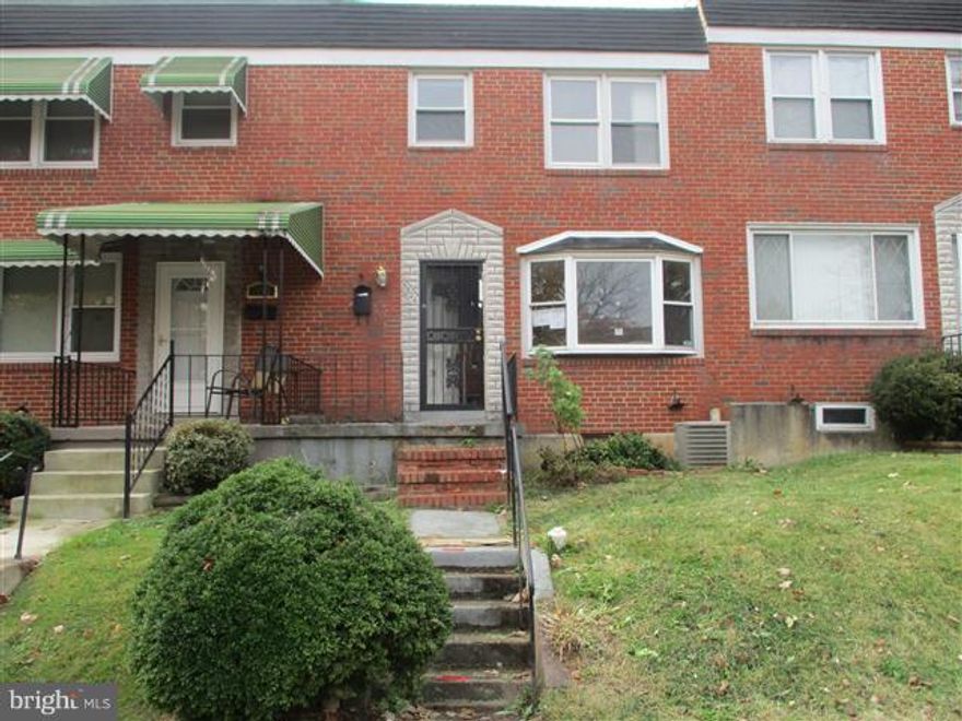 3 Levels of living space and private parking pad in rear in this all brick town home ! Hardwood floors in dining room & bedrooms. Open floor plan on main level. Kitchen has breakfast bar. Lots of built in shelving through-out. Upper level has 3 bedrooms & full bath. Lower level will make a great family room. Lots of storage and  1/2 bath. Covered rear porch & fenced rear.OPENS TO INVESTORS DEC 1ST