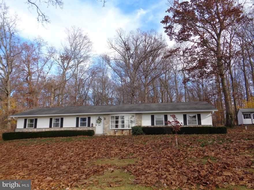 4 Bedroom 2 Bath Rancher on Ideal .95 Acre Lot Overlooks Farm and Backs to Wooded Area. Hardwood Floors Throughout, Eat in Kitchen with Propane Gas Range Plus Double Wall Oven.  Unfinished 1,537 Sq. Ft. Basement with Unlimited Possibilities. Paved Driveway. Oversize  2 Car Garage includes Tools & Shelving. Detached 1 Car Garage w/Electric, Tool Shed . Oversize Deck off Kitchen Overlooks Wooded Privacy. Roof is 15 Years Old, Water Heater '17, HVAC '06. Home has Been  Well Maintained in the Same Family Since 1980