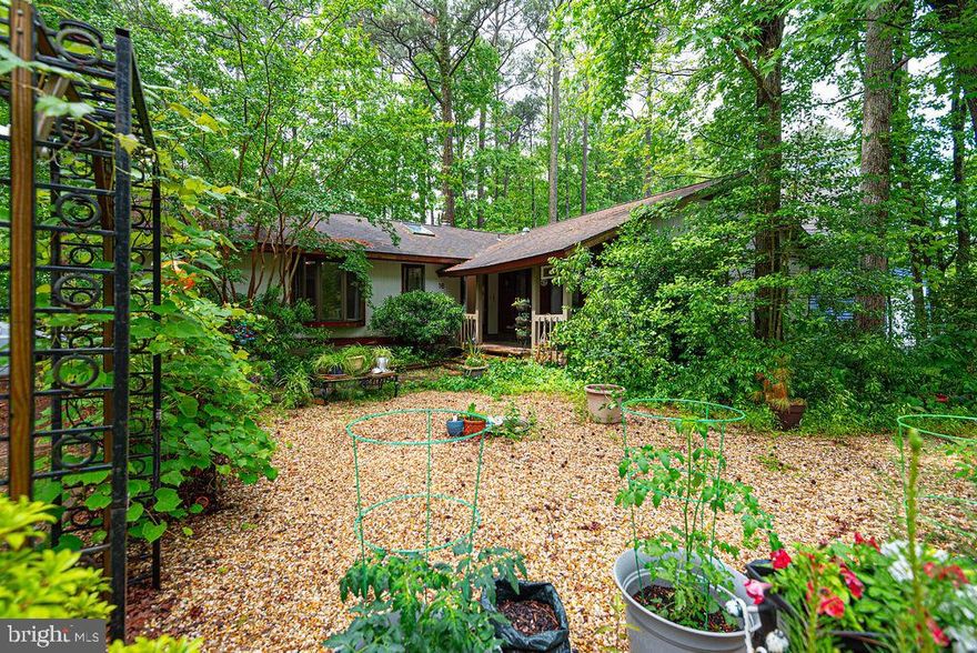 Don’t miss your chance to bring this Salt Grass Cove property back to life! Fixer-upper  located  on an extra large lot  in the award-winning & amenity filled Ocean Pines community.  The crawl space is in need of extensive repair, and the home is priced accordingly.  Almost 2000 square feet with an oversized detached garage and a huge 3 season vinyl tech sunroom.   The wood burning brick fireplace, vaulted ceiling, and skylight highlight the living room, which is open to the eat- in island kitchen with newer appliances. Adjacent to the kitchen is a spacious laundry/ utility room and a formal dining room.  Completing the floor plan are 3 bedrooms, 2 baths, and a Home Office / Family Room.  Roof is approximately 14 years old. No lawn to mow here, just relaxing on the front porch or rear deck after your renovations are complete!