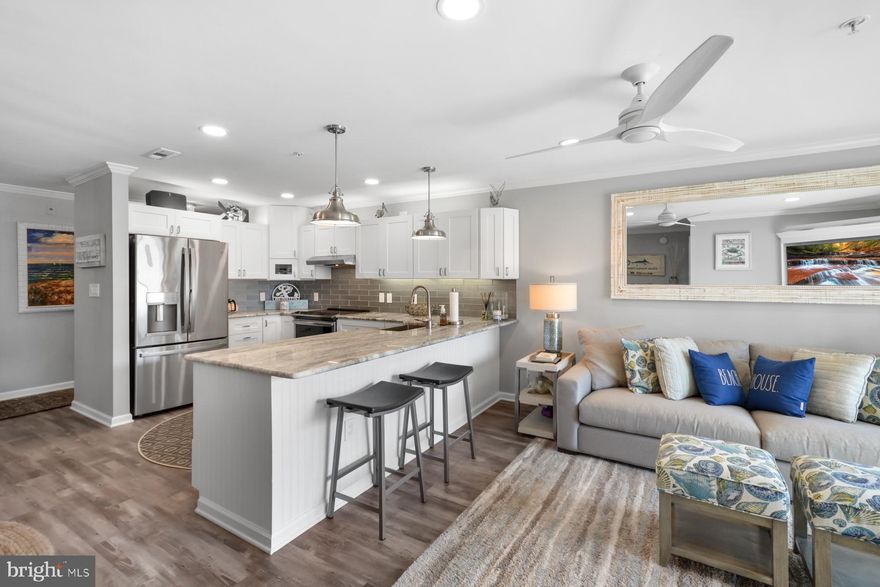 Nestled in the one of the greatest communities in North Ocean City, this spectacular waterfront condo offers the epitome of coastal living, complete with a private boat slip and a host of upscale amenities. Meticulously redone with high-end finishes, this waterfront oasis is the epitome of elegance and relaxation.  

Breathtaking Waterfront Views: Start each day with awe-inspiring sunrises over the serene waters of the Assawoman Bay. Your private balcony offers unobstructed vistas of the bay, creating a peaceful and picturesque setting that's perfect for morning coffee or evening sunsets.

Boating Enthusiast's Dream...with a dedicated boat slip just steps from your door, you'll have effortless access to the open waters of the bay and beyond. Whether you're a seasoned mariner or a novice explorer, this property offers the ultimate boating lifestyle.

Every corner of this condo has been thoughtfully updated and designed with an eye for luxury. High-end finishes, and premium appliances grace the open-concept kitchen, creating a stunning focal point for gatherings and culinary endeavors.

This community takes seaside living to the next level with a range of amenities, including indoor and outdoor pools, Hard Tru tennis courts, and a fully equipped fitness center. You'll have endless options for relaxation and recreation, all within your own private enclave.

Nestled in North Ocean City, this property provides a tranquil escape from the bustling boardwalk area while still being within easy reach of all the entertainment, dining, and shopping options Ocean City has to offer. You can enjoy the best of both worlds, with peaceful bayfront living and vibrant city life just minutes away.

This condo is located in a friendly and welcoming community, perfect for both year-round living and seasonal getaways. You'll find like-minded neighbors who share your love for the beach and the bay, creating a sense of belonging that truly sets this location apart.

This bayfront condo in North Ocean City offers a rare opportunity to embrace a life of waterfront luxury, with the added bonus of a boat slip and a wide range of amenities. It could make a fantastic rental, with yearly estimates upwards of $48,000. A rental market analysis provided by BluVista Vacation Rentals is available in the uploaded documents. Experience the epitome of coastal living in a property that combines impeccable design, breathtaking views, and a vibrant community. Don't miss your chance to make this your own piece of paradise.