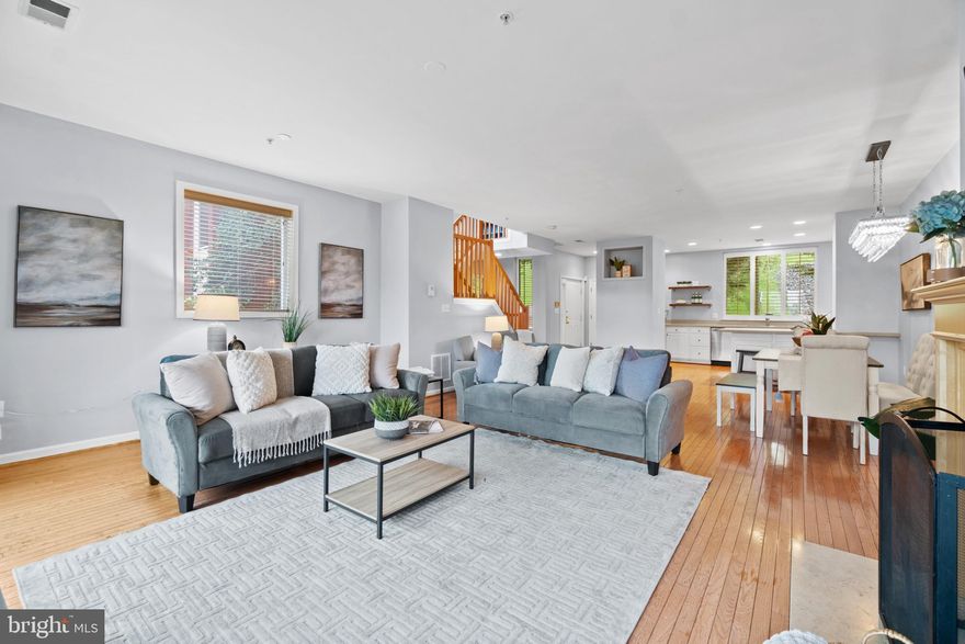 Beautiful end unit in Federal Hill with two garage and water view! This home features a rear entry garage, lower level office, half bath, and laundry room. Large living room with sliders to deck, hardwood floors and gas fireplace. Open white kitchen with white cabinets, stainless steel appliances and breakfast bar. Primary bedroom with second deck with water views of the harbor, en suite bath with double vanity, sunken tub, shower and walk in closet. Additional bedroom and hall bath on this level. Tons of natural light! Great location!