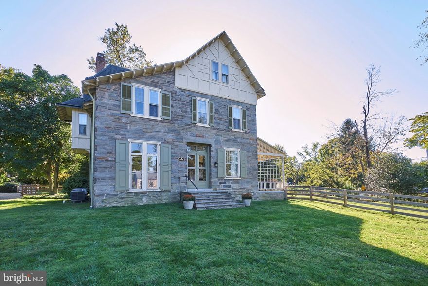 This unique and beautifully updated 6 bedroom Victorian home is set on a large corner lot in desirable Wyndmoor which includes a 3 bedroom carriage house and 3-car garage. The main house has been tastefully and sensitively updated by the current owner to show off the beautiful natural light that abounds throughout the oversized windows. Original architectural details such as crown molding, deep windowsills, original refinished hardwood floors and floor to ceiling windows can be found throughout this charming home. The sunlit gourmet kitchen features custom cabinetry with granite countertops, center island with seating and a delightful built-in banquette. The rear mudroom with built-in storage leads to a convenient laundry room/powder room with sliding barn door. Towards the front of the home, the living room and dining room, both with fireplaces, are serene, sunlit spaces for entertaining or more intimate family gatherings. Sit on the side porch overlooking the peaceful fish pond and manicured yard. On the second floor are 4 large bedrooms with 2 full baths, including a gorgeous, new main hall bath. On the third floor are an additional 2 bedrooms and a large bath with clawfoot tub and pedestal sink. Recent upgrades include: all new electric, new central air, new main hall bath and new septic system. The separate 3 bedroom carriage house would be perfect as an au pair suite, in-law suite or home office, with recently renovated kitchen with farmhouse sink, and quaint courtyard area overlooking the fish pond. This lovely home in a desirable Wyndmoor location is just steps from Chestnut Hill - walk to the shops and restaurants along the Avenue, the Gravers train station for an easy commute to Center City Philadelphia, and to the Fairmount Park trails.