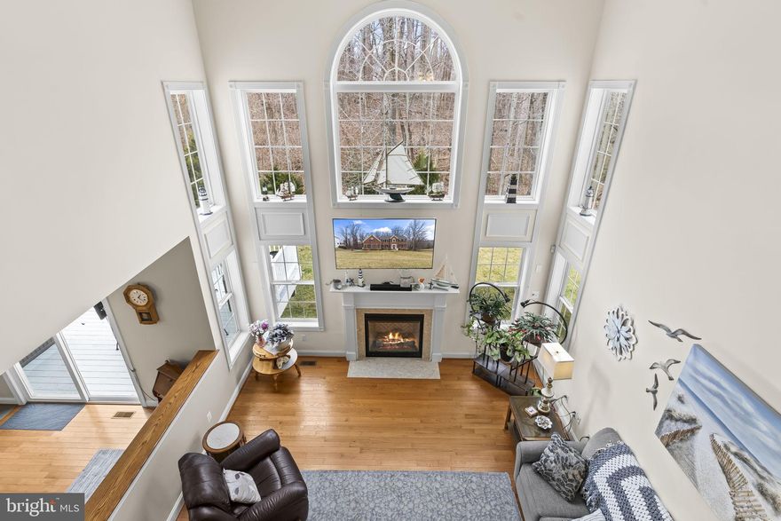 Don't miss this stately brick front colonial, Quality Built Homes, WILLOW model.  Nestled in the sought after Farms at Hunting Creek community, this floor plan offers great function and flexibility, and 2 staircases for some extra flair! The home boasts a soaring foyer, and 2 story family room letting the sunlight pour in through all of the windows!  The "grand" kitchen is a chefs paradise, with rich maple cabinetry, light colored granite counter tops, a huge island with seating for 3, double wall ovens, GAS cooktop, and an extra stand alone freezer that conveys.  Dine in your eat in kitchen, or separate dining room for more formal gatherings.  The main level also has a living room, which could be used as an office, and an office that could be used as a main level 6th BEDROOM, and full bath-flexibility! The entire main level is covered in rich hardwoods. Follow either staircase upstairs to 3 generously sized bedrooms, and an expansive primary suite.  Primary suite offers a sitting area, bathroom with oversized tub, separate vanities, a tiled walk in shower, and a walk in closet spans the length of the 2 car garage. Did I also mention the laundry room is on the upper level-no more lugging laundry upstairs.  Spread out in your fully finished basement, with 5th bedroom, full bath, and a massive blank canvas recreation space. There is wiring in the ceiling to create a theater room, bring your pool table, gym equipment, craft table, anything that suits you!  There is also a sizable storage area, since every home needs that.  Garage enthusiasts-the floor has been recently finished in EPOXY by Renuity. The yard has underground irrigation for keeping your grass lush. The back looks onto woods where you can sip coffee on your deck. There is also a large shed to keep all your toys. In the Farms at Hunting Creek, you will feel a true sense of community.  Enjoy sidewalks & tree lined streets, a playground with a gazebo, a lake that you can fish in, basketball courts, and a soccer field. Zoned for AWARD winning Plum Point Middle & Huntingtown High School, close to Prince Frederick for shopping, and an easy commute north or south on Rt 4.  Come see it!