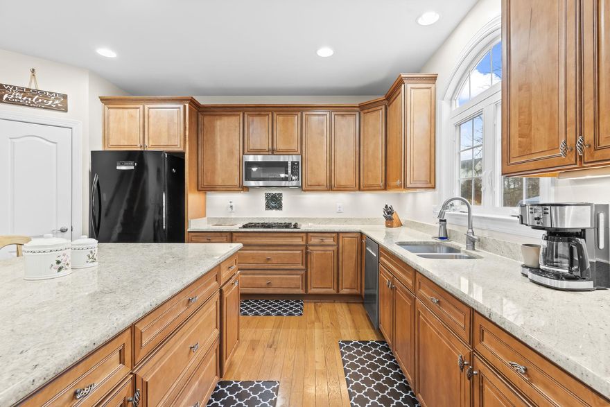 OPEN HOUSE SATURDAY 4/18 11AM-1PM. Don't miss this stately brick front colonial, Quality Built Homes, WILLOW model.  Nestled in the sought after Farms at Hunting Creek community, this floor plan offers great function and flexibility, and 2 staircases for some extra flair! The home boasts a soaring foyer, and 2 story family room letting the sunlight pour in through all of the windows!  The "grand" kitchen is a chefs paradise, with rich maple cabinetry, light colored granite counter tops, a huge island with seating for 3, double wall ovens, GAS cooktop, and an extra stand alone freezer that conveys.  Dine in your eat in kitchen, or separate dining room for more formal gatherings.  The main level also has a living room, which could be used as an office, and an office that could be used as a main level 6th BEDROOM, and full bath-flexibility! The entire main level is covered in rich hardwoods. Follow either staircase upstairs to 3 generously sized bedrooms, and an expansive primary suite.  Primary suite offers a sitting area, bathroom with oversized tub, separate vanities, a tiled walk in shower, and a walk in closet spans the length of the 2 car garage. Did I also mention the laundry room is on the upper level-no more lugging laundry upstairs.  Spread out in your fully finished basement, with 5th bedroom, full bath, and a massive blank canvas recreation space. There is wiring in the ceiling to create a theater room, bring your pool table, gym equipment, craft table, anything that suits you!  There is also a sizable storage area, since every home needs that.  Garage enthusiasts-the floor has been recently finished in EPOXY by Renuity. The yard has underground irrigation for keeping your grass lush. The back looks onto woods where you can sip coffee on your deck. There is also a large shed to keep all your toys. In the Farms at Hunting Creek, you will feel a true sense of community.  Enjoy sidewalks & tree lined streets, a playground with a gazebo, a lake that you can fish in, basketball courts, and a soccer field. Zoned for AWARD winning Plum Point Middle & Huntingtown High School, close to Prince Frederick for shopping, and an easy commute north or south on Rt 4.  Come see it!