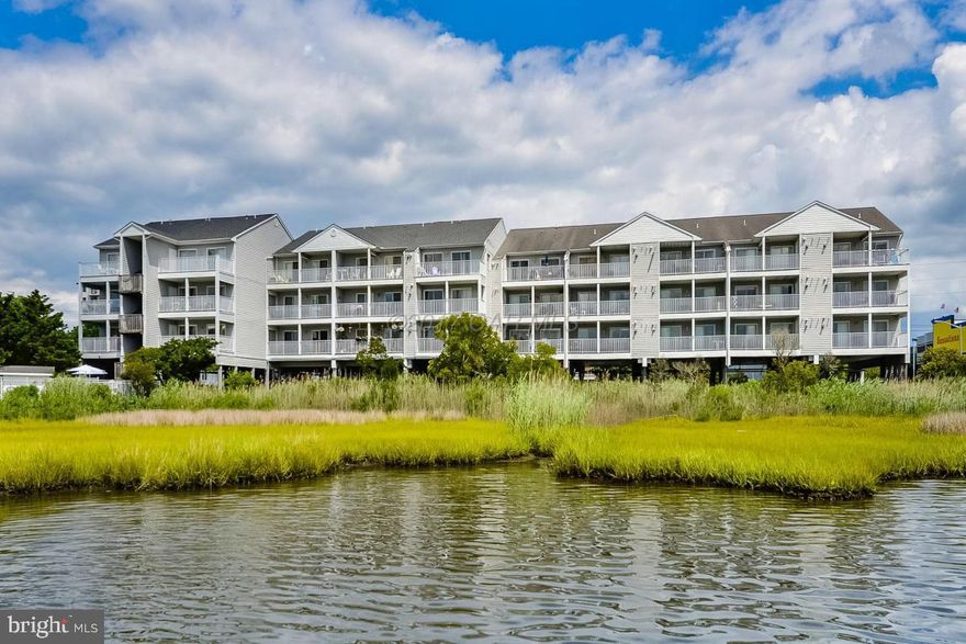 Absolutely beautiful views from this well maintained 2 bedroom 2 bath condo in centrally located mid town location.  Top floor unit with cathedral ceilings, nice balcony and gas fireplace (propane). Close to the beach (crosswalk) and restaurants.   Very nice building that offers elevator and pool.  Unit has tankless hot water heater.  One year AHS warranty being offered for the benefit of the Buyer.  This property is truly turn key and ready for immediate enjoyment.