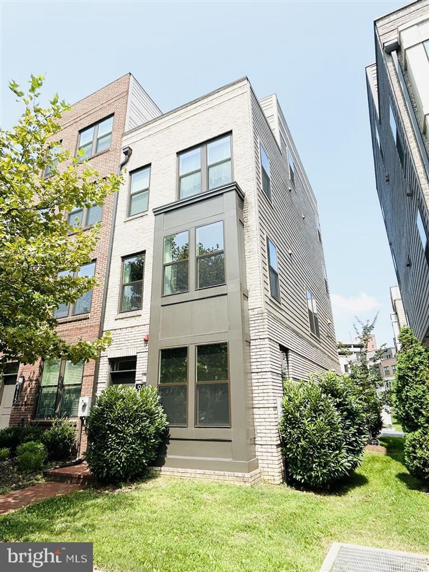 Modern End-Unit 4-Level Townhome with Rooftop Terrace in King Farm! Welcome to 913 King Farm Blvd — a like-new, luxurious end-unit townhome, offering light-filled living space and unobstructed tree views. New construction townhome purchased in 2020 and barely lived in. This elegant residence features 3 bedrooms, 3.5 baths, and a spacious loft, perfect for a family room and home office, along with a private rooftop terrace with stunning views. The open-concept main level boasts a gourmet kitchen with upgraded KitchenAid appliances, quartz countertops, hardwood floors, and abundant natural light on three sides. Additional highlights include a 2-car tandem garage with a full-size driveway (driveway fits a standard SUV), and a low $136 HOA fee. Enjoy access to two large community pools, parks, tennis/paddle ball courts, dog park, nature trails, restaurants, shops, and a free shuttle to the nearby Shady Grove Metro. With easy access to DC and Northern VA, this move-in ready home combines modern convenience, comfort, and location in one of Rockville’s most desirable neighborhoods! Can also be sold partially furnished (negotiable) for added convenience.