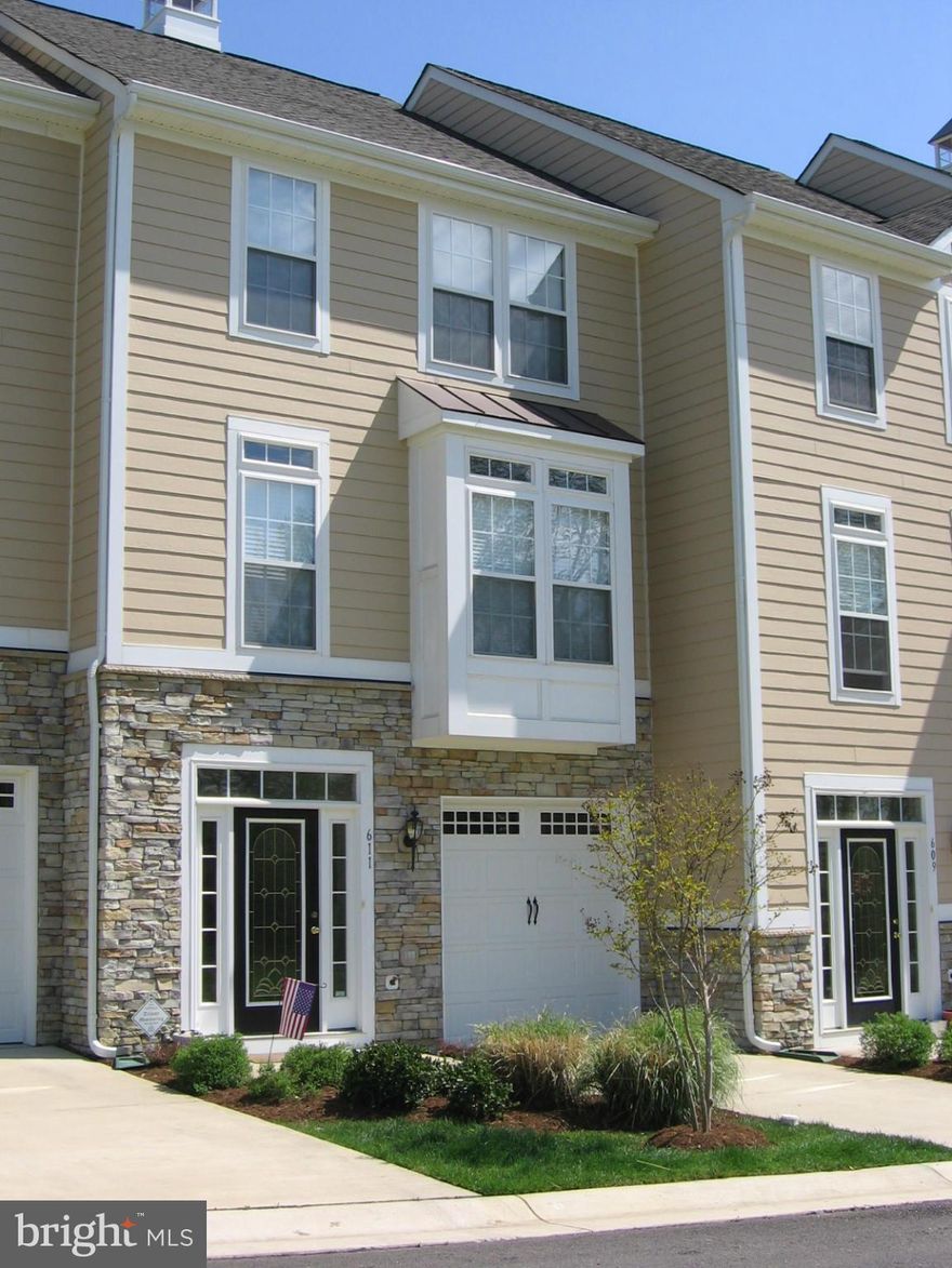 Luxury townhome in waterfront community of Monroe Point. Custom accents featuring wood and tile floors, owner's suite, wrap around Trex deck with water views. Entry level masterbedroom/family room.   Includes waterfront trails, community pier.  Minutes to Dalghren.  Golf cart community.  Includes HOA fee.