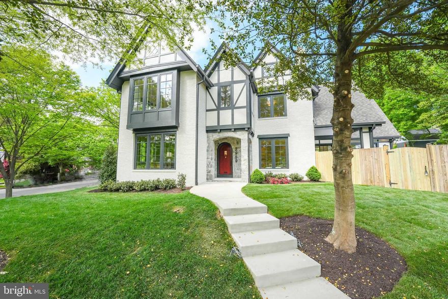 Nestled amidst the serene charm of Chevy Chase, DC, 2959 Northampton St. NW stands as a testament to timeless elegance and meticulous craftsmanship. This resplendent Tudor home, spanning over 6,300 sf, sits majestically on an expansive 8,800 sf lot, enveloped by a large private rear yard that evokes a sense of tranquility. As you approach, the traditional Tudor front entry tower welcomes you with its stone surround entry porch, adorned with intricate herringbone and timber detailing, setting the tone for the grandeur that lies within. Step through the original old-growth solid wood front door, now adorned with diamond glass and Baldwin hardware, into a realm of sophistication and comfort. The main level unfolds with an air of refinement, boasting a paneled formal living room graced by a wood-burning fireplace, built-ins, and beamed ceiling, offering a sanctuary for intimate gatherings. Adjacent, the dining room, bathed in natural light, exudes opulence with its beamed ceiling, custom trim, and wallpaper, providing an exquisite backdrop for memorable dining experiences. For those inclined towards productivity, a light-filled office awaits, adorned with six windows and custom floor-to-ceiling built-ins, offering a serene space for focused work. Culinary enthusiasts will revel in the fully custom kitchen, where every detail has been meticulously curated for both functionality and aesthetics. From the custom range wall with an extra deep windowed alcove to the oversized island with seating for four, adorned with a myriad of amenities including a 48” Bluestar gas range, two paneled dishwashers, and a true counter-depth Bosch refrigerator, this kitchen is a chef's paradise.  In addition, a custom wet bar with quartzite countertops, custom fabricated quartzite sink, two beverage refrigerators, antique mirror, and glass-paneled tower cabinets provide an elegant space for entertaining guests. A striking sun-filled family room is the pièce de résistance of this home, boasting a volume ceiling, three exposures, and 9’ sliding doors that invite natural light to flood the space. Two gorgeous chandeliers add a touch of sophistication and ambiance to this inviting gathering space. The allure of the main level extends outdoors, where a covered rear porch and sunny brick patio beckon for alfresco entertaining amidst the privacy of the fenced rear yard. Ascending to the second floor reveals an absolutely stunning true primary suite, suffused with natural light and boasting a voluminous ceiling, spa-like bathroom with quartzite counters and custom walnut cabinetry, and an expansive closet. Three additional suited bedrooms, each boasting custom full bathrooms and ample closet space, ensure unparalleled comfort for family and guests alike. The third floor offers two additional bedrooms, a fifth full bathroom, a generous recreation space, and a hidden ‘camp’ room, providing versatile options to accommodate various lifestyle needs. Meanwhile, the lower level boasts a second family room, seventh bedroom, sixth full bathroom, and ample storage space, ensuring every need is met with unparalleled luxury and convenience. Designed by Shawn Buehler of BFM Architects and meticulously constructed by WWK Construction, this home epitomizes modern luxury while preserving the timeless charm of its Tudor heritage. Situated in the heart of Chevy Chase, DC, residents enjoy unparalleled access to a myriad of amenities, including Lafayette School & Park, Broad Branch Market, and the year-round farmer’s market at Lafayette Elementary. With Rock Creek Park, shops, restaurants, and public transportation just moments away, every convenience is within reach, completing the epitome of sophisticated urban living.