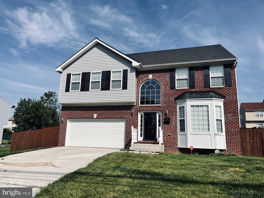 Come and see this solid brick colonial home in the neighborhood of Sunrise Cedars. Upon entry, you will find a large living room with wide windows, formal dining room with hardwood floors, county kitchen with granite countertops, island table and wood cabinets that opens to a family room with fireplace. The upper level boasts a spacious master bedroom with walk-in cabinets, dual vanity, whirlpool tub & separate shower, two additional bedrooms with built-in closets and two full bathrooms. The full basement can be used as an additional storage or finish off for more living space. The enormous exterior has a wide driveway, a deck that is great for outdoor fun and a private fenced rear yard.