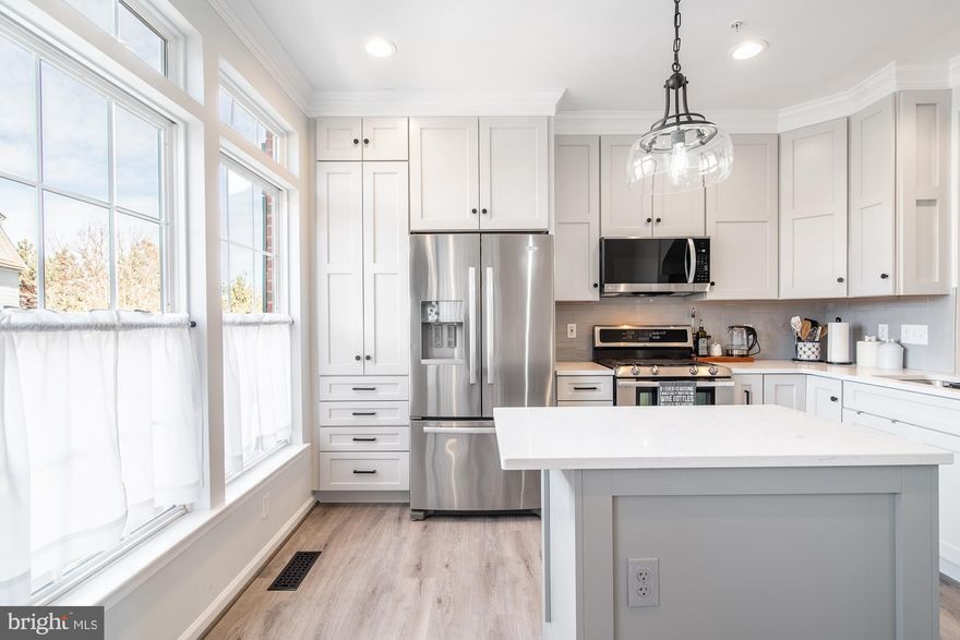 Welcome to Huntington Grove! This small, tight knit community of only 40 townhomes combines  the proximity to convenience without sacrificing on home features. Immediately upon entering this 4 level townhome, you’ll be greeted with new luxury vinyl flooring throughout the entryway and lower level bonus room. Upstairs, on the main level, the updates continue with a 2023 kitchen remodel that left no detail overlooked. The details of this kitchen remodel include custom cabinetry built to the ceiling, quartz countertops, custom built island, and a pantry complete with shelving and pull out drawers for added storage. Immediately off of the main level, you’ll find a large deck that is perfect for grilling and hosting friends. The upper 2 levels of the home consist of the three spacious bedrooms, each with its own bathroom attached and plenty of closet space. If even more storage is needed, you’re in luck! The top floor of the home includes a storage space that is ideal for seasonal decorations, bulk items, or any other items that need to be stored. A few other noteworthy features/updates for this home include: New roof (2023), new deck boards (2020), new ceiling fans, updated washer/dryer (within the past 5 years), 1 car garage plus a 1 car driveway,  and a backyard with separate patio and grass areas. In the immediate vicinity of the home, you'll be able to enjoy walkability to the new South Alex shopping center, multiple food options, and you're exactly 1 mile from the Huntington Metro. This home is a must see and will not last long!