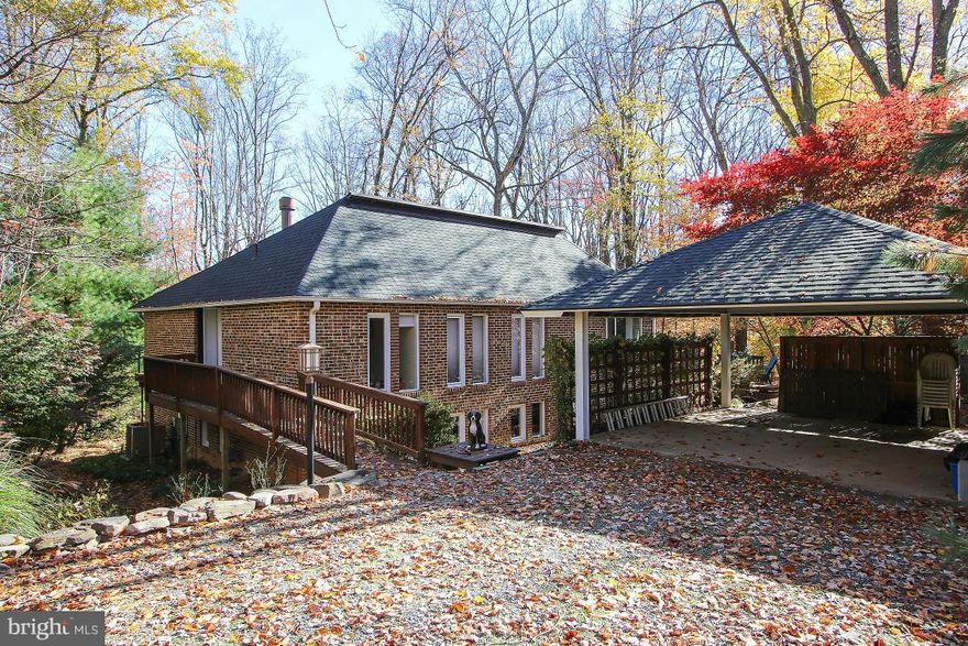 Gracious two level contemporary home features 5 BR, 2.5 BA,situated on a private cul-de-sac surrounded by woods. Windows and light galore! Wood burning fireplace. Stainless steel appliances, glass cooktop, new quartz countertops. Main level Master, walk-in closet. Hardwood floors on main; LL has 3 spacious BRs, full BA, large family room with built in cabinets; sep Laundry room.