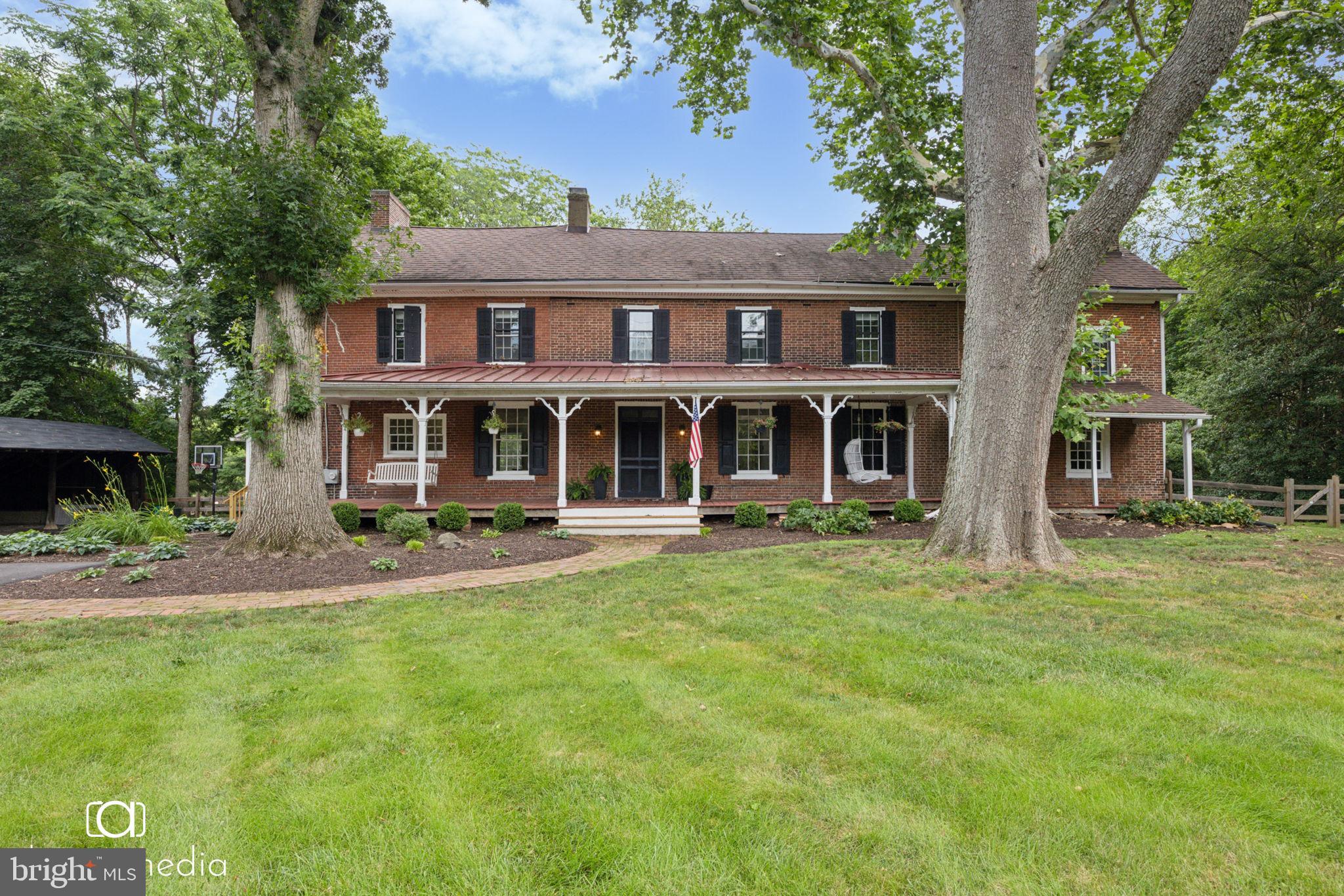 Welcome to 547 Concord Road, which has stood proudly as one of the earliest homes built in Pennsylvania and served many uses in the community both before and after the Revolutionary War. Situated within the Garnet Valley School District, this home was built in 1695 and owned by Col. John Hannum, a politician, businessman, and colonial militiaman in Chester County. The home is registered in the Pennsylvania Inventory of Historic Places and was one of the first licensed taverns in Pennsylvania (1720). It is located on 2 flat acres of land with a 3-car carport and lush surroundings. A covered porch runs the length of the front of the house, and many of the original details including doors, moldings and mantles are still intact. Several rooms feature one of the nine fireplaces, as well as wide planked, original hardwood floors on the first floor. The kitchen, primary and guest baths have been updated by the current owner, who also created a generous primary closet space. There are five bedrooms, one of which is part of an attached guest suite complete with its own kitchen. This space can be closed off from the main house and be income producing. The walk-up attic spans the entire length of the house, as does a generous basement with unlimited storage with an outside entrance. The home features central air conditioning, a modern Well filtration system, and countless bits of charm throughout. Outside, the enormous and private backyard and patio provide limitless play or gardening spaces. Don’t throw away your shot at owning a piece of American history while nestled in a premier school district and only minutes away from the conveniences of Glen Mills and North Wilmington (tax free shopping) and easy access to Media and King of Prussia.
