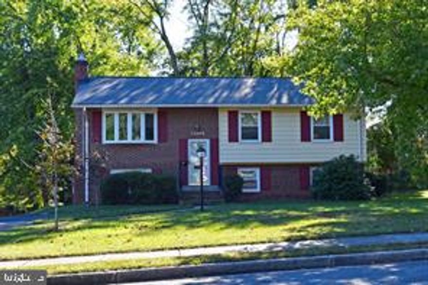 Split foyer with 3 bedrooms, 2 bathrooms, deck, fenced in backyard, family room, rec room, wood burning fireplace,, walkout basement.