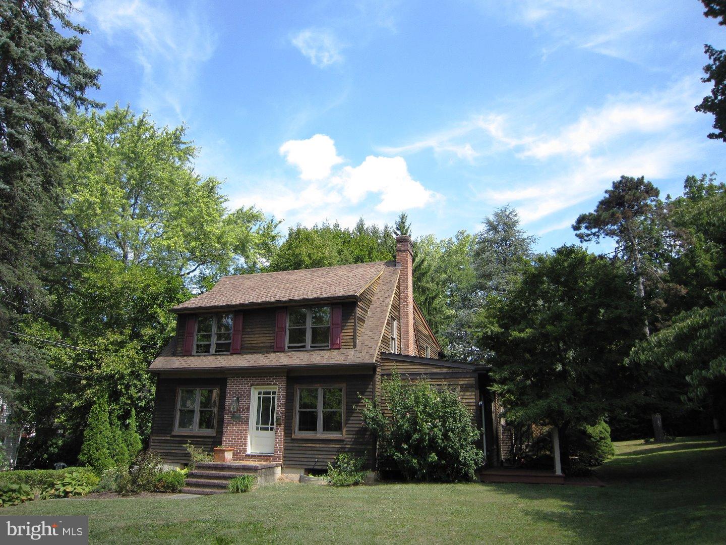 How refreshing to find a Contemporary home in a park like setting with wonderful spots from which to view the foliage and wild things. Yet you will be in walking distance to the center of Swarthmore, the train and College. Features inside include an Eat-In Kitchen with Dining Area already for you to take a seat and eat,(food not supplied). The large Family Room has a beautiful fireplace surrounded by windows so you will see the view. An entertainment center includes a TV just for you. There are many leaded glass windows hanging and installed throughout the home adding a classy touch. From the huge Master Bedroom with walk-in closet and exit to a covered Balcony you can sit day or night and soak up the breeze. And the taxes are great. Springfield Schools.