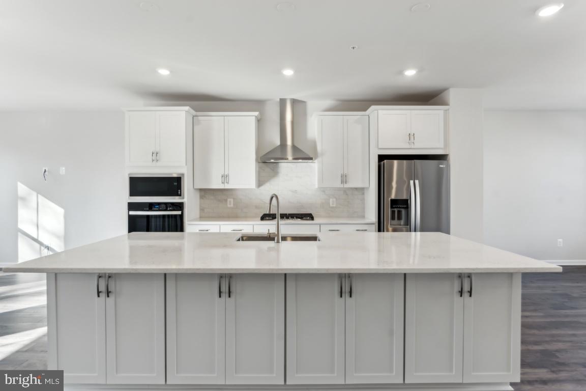 **** IMMEDIATE DELIVERY **** ($482,600.00) FOR A LIMITED TIME TAKE ADVANTAGE OF INTEREST RATES AS LOW AS 5.50% FHA / VA and 5.99% CONV - LETS MAKE A FANTASTIC DEAL ON YOUR NEW HOME! - Lot 351 – 9600 Killenney Pl. Waldorf, MD 20601 (INTERIOR UNIT) – The Finley 2267 Sq. Ft. (3) Bdr. 3 baths 2 car garage. This luxury town home offers a spacious rec room on the entry level with a half bath with oak stairs leading up to the main level of the home. The main floor is all hardwood that has a gourmet kitchen with stainless steel Whirlpool appliances, quartz counter tops and the great room that leads to a 10’x20’Trex Deck overlooking your wooded views of your private back yard. The primary bath has quartz counter tops and a nice size standing shower with a seat.