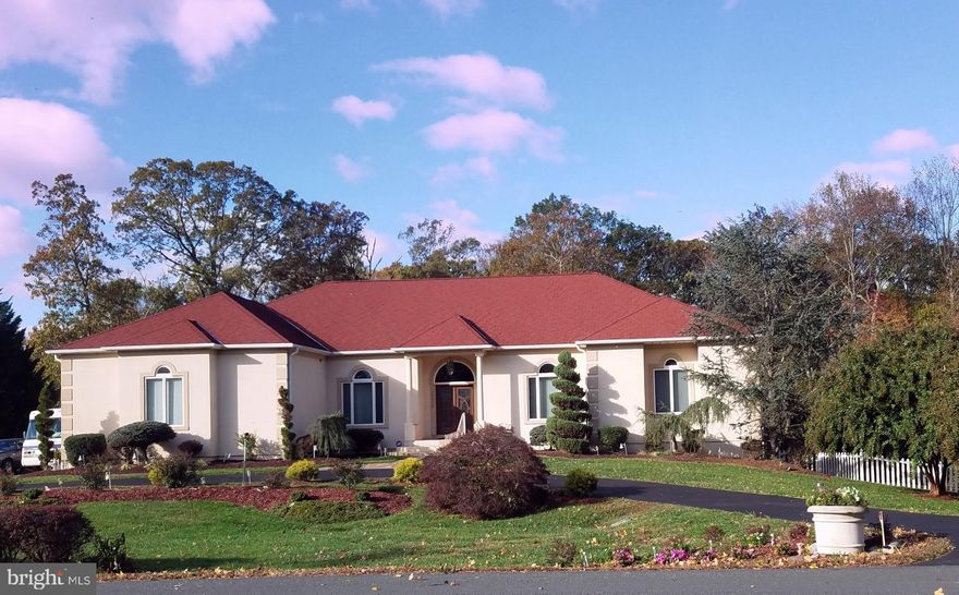 Welcome, where privacy meets Convenience with this 8400 sq. ft. (main and basement) Custom built 5 bedroom 5.5 bath home, nestled on a 3.48-acre lot.  This one-of a kind Stucco Rambler masterfully blend timeless elegance with natures' tranquility, offering the perfect balance of peaceful seclusion and community connection.  A rare find in today's market, this home is a haven for those seeking both escape and engagement without the restriction of an HOA.  From the moment you arrive, you'll notice the thoughtfully maintained grounds by attentive owners who have added charming practical touches throughout the landscape of the home.  Inside, 12-foot ceilings flood the home with natural light, creating an airy, expansive atmosphere. The heart of the home boasts a bright, open concept kitchen complete with stainless steel appliances, abundant cabinetry and walk-in pantry, and a spacious eat-in kitchen that call for serenity.  Retreat to the spacious owner's suite, featuring a private deck, fireplace, sitting room, spa inspired bathroom with cathedral ceilings, marble floors and vanity tops, separate walk-in shower, and two large walk-in closets. The basement is fully finished with a full kitchen and stainless-steel appliances, two bedrooms and two baths, family room and separate Entertainment space with glass French doors that provide both functionality and privacy.  Step outside to your personal backyard retreat, framed by mature landscaping, including Crepe Myrtles, Holly trees, Rock Garden, Gazabos, Koi Pond, inground pool and bar.  Vinyl privacy fence on the sides and chain link fence at the back ensures both security and scenic views. This is a rare opportunity to enjoy refined living, beautiful surroundings, all in one remarkable home.