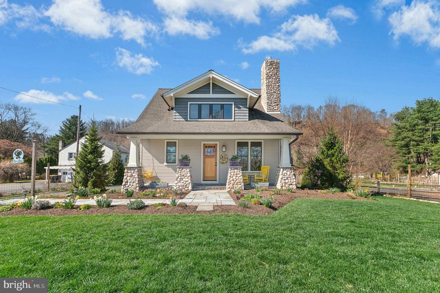 Mature trees, specimen plantings, and a wildflower meadow buffer this appealing farmhouse in Tinicum Township, with views of the Delaware River. With canal access in the back, and a second parcel along the water complete with a dock, River Roost has an array of modern amenities and a quaint cottage ambiance. 

Built in 2018, the house features glacial deposit granite stonework and copper gutters and downspouts. Gleaming Brazilian cherry floors are found throughout the home, lending an easy and open feeling to the floor plan. The living room boasts a gas fireplace with a custom walnut mantel, and opens gracefully to the dining room. Chefs will delight in the handsome eat-in kitchen, outfitted with leathered granite countertops, gas cooking, and island with seating. A powder room and laundry/mudroom are convenient first floor amenities.

The first floor primary suite is spacious, with ample windows, a large walk-in closet, and luxurious marble-accented bath. Upstairs, two additional sunny bedrooms share a hall bath along with a cozy seating area. Outdoor amenities include a porch and patio made from glacial deposit granite, a detached 2-car garage with loft storage, and a greenhouse. 

Set on a delightful 1.7 acre parcel with bluestone walkways, solar landscape lighting, and fruit trees, River Roost is an ideal weekend getaway or full-time residence. A short drive along the Delaware River leads to unique shopping and dining options.