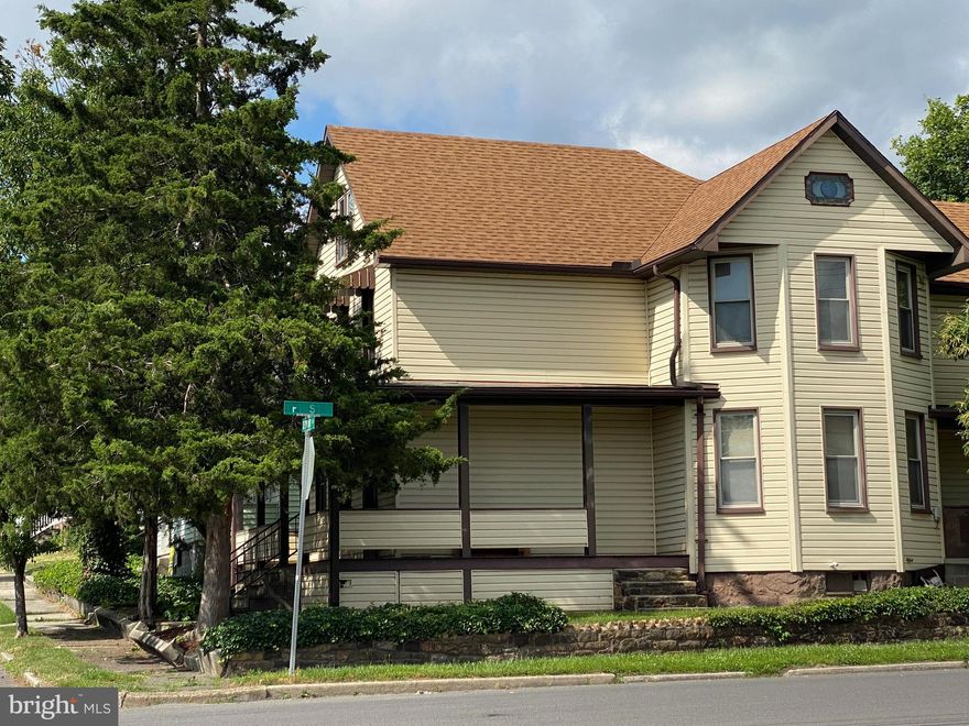 You won't believe the space in this large, 4 bedroom, 2 full bath home!  Situated on a corner lot,  this home features a livingroom, diningroom, kitchen, full bath, and another room that could be used as an office, rec  room, or potentially a 5th bedroom on the main level.  On the second floor you will find 4 bedrooms, and a full bath.  The laundry is located on the main level.  The home has an attic for storage and a partially fenced backyard.  The main level of the home is handicapped accessible with a ramp that goes to the side door.  There's a large, wrap-around front porch!   This  home is priced to sell so don't miss the opportunity, call today for a showing!