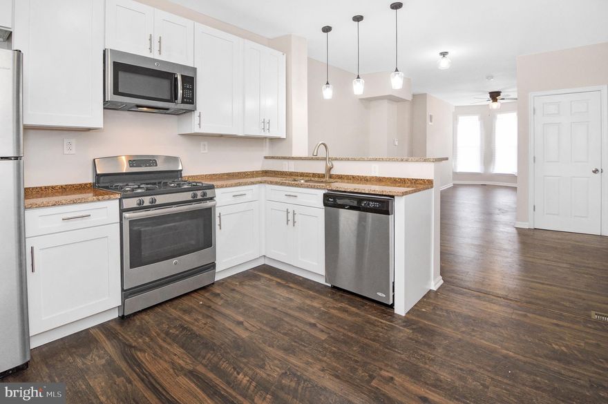 Spacious 3 bed 1 bath townhome located close to major highways and area amenities.  Walking distance to ravens and orioles stadium, top golf and University of Maryland.   Updated kitchen Includes granite counter tops, stainless steel appliances and washer and dryer.   Updated bathroom with new tub surround.  Hard wood floors throughout.  All applications go through 1choicepropertymanagement.com.