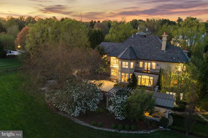 Thank you for your interest in 648 Deerfield Farm Court.

There is no lockbox. Thank you!

Welcome to an exceptional entertainer's paradise nestled in the heart of Great Falls, Virginia. Presenting 648 Deerfield Farm Court, a meticulously designed custom French Colonial residence built by Hans Schmit and Winthrop Custom Builders. This luxurious home, positioned on the most sought-after lot within the esteemed Deerfield Farm Subdivision, offers privacy and prestige with no homeowners' association to oversee its 2.3 pristine acres.

Step inside to discover an elegant, open-plan interior spanning a total of 8,385 finished square feet, with 5,885 of those above grade. The home features five generously sized bedrooms, each complete with their own ensuite bathrooms, and an additional three half bathrooms for guest convenience.

The residence is located within walking distance to Great Falls Village and falls within the highly coveted Langley School District, ensuring both convenience and educational excellence.

The heart of the home is the gourmet kitchen, which is perfectly designed for both cooking and entertaining. It features stained maple custom inset cabinets, a 48” Viking 8 burner cooktop (including a grill), double wall ovens, a warming drawer, and a Subzero refrigerator. The kitchen is complemented by three sinks, two dishwashers, granite counters, a painted center island, and a walk-in pantry. Adjoining the kitchen, a breakfast room opens out to the lavishly landscaped sanctuary, creating a seamless flow between indoors and out.

The opulence continues with the main level hosting an elegant dining room, a sun-filled great room with a stone masonry fireplace, and a formal living room with an elegant limestone wood-burning fireplace. Additionally, there is a pristine, stately office featuring high-end cherry paneling, built-in cabinetry, and a gas fireplace.

The upper level is just as impressive, featuring an expansive owner’s suite with a custom marble fireplace, French doors leading to a new Trex balcony with stunning views, and a sophisticated oversized ensuite bathroom. Each additional bedroom provides unique, refined comforts and privacy.

The lower level opens out to an intimate outdoor living space and includes a spacious recreation area with a natural cherry cabinetry wet bar, a tasteful wine cellar, a gigantic mirrored gym, and a grand home theatre or music room. There's even a pet spa, perfect for grooming your pampered pet.

Outside, the estate is nothing short of spectacular with features crafted by Charles Owen and Fine Landscapes valued at over $1 million. Enjoy multiple outdoor living spaces including a multi-season grilling kitchen, bar, fireplace, pergola, and multiple patios. The grounds are further enhanced with a spa, cascading koi pond with waterfall, and meticulously maintained gardens featuring mature landscape plantings.

Added bonuses include a 3-car oversized garage, new security and smoke detection systems, a water softener, and wired surround sound using Sonos. Planning for further customization is made easy with permits already granted for a pool and pool house.

648 Deerfield Farm Court is not just a home; it's a lifestyle. Prepare to host, entertain, and live in unparalleled elegance and comfort.