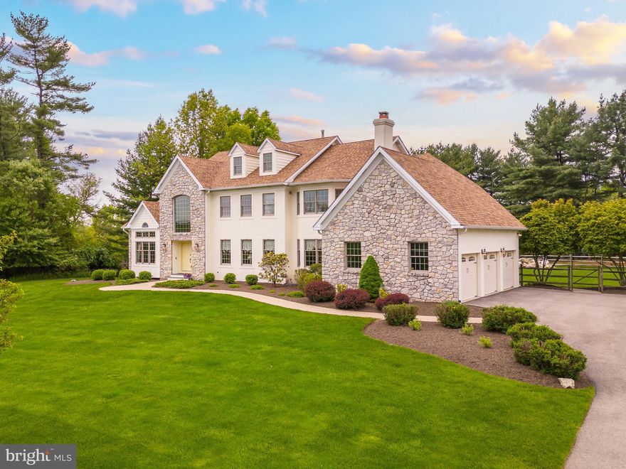 Welcome to 606 Creek Lane, an immaculately maintained 4 bedroom, 3.5 bath colonial on 1.73 picturesque acres in Country Club Estates of Whitemarsh. Situated towards the end of a private, tree-lined street, this handsome home features sunlit spaces and an expansive rear deck overlooking a fabulous in-ground pool and patio. Lovely details such as crown molding and beautiful hardwood floors can be found throughout. Double front doors open to the 2-story foyer, with a private home office with high, vaulted ceiling and built-ins, and a large living room. Several windows in the living room and a big bay window in the dining room flood these spaces with light. The large dining room features a gas fireplace and wainscoting. The oversized eat-in kitchen has a center island with prep sink, ample cabinet space, double oven with convection, separate cooktop, wet bar with beverage fridge and wine rack, and large walk-in pantry. The adjoining breakfast area offers sliders to the deck, and windows showcasing the rear deck and pool. The step-down family room is just off the kitchen and offers a gas fireplace and an additional set of sliders to the expansive rear deck. A powder room, second staircase, small bonus room currently used as a gym, and family entrance with access to the 3-car garage complete the first floor. At the top of the main stairs is the open and spacious primary suite featuring a sitting area, large walk-in closet, and newly renovated bathroom with double vanities, soaking tub, walk-in shower and private water closet. Two large secondary bedrooms sharing a full bathroom with double vanities, a fourth bedroom with full hall bath, and laundry room complete the second floor. The expansive rear deck and private in-ground pool surrounded by exquisite landscaping and mature trees and large, flat yard will become favorite places for warm weather entertaining and summer BBQs, and are just a few of the many highlights of this impressive home. Centrally located in the award-winning Colonial School District next to the Green Ribbon Walking Trail and Fort Washington State Park, close to major highways, and just a short drive to the shops and restaurants of Flourtown and Chestnut Hill.