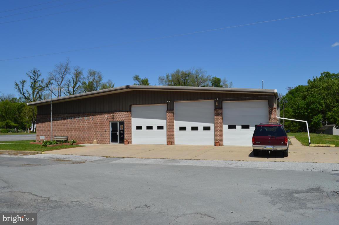Zoned Light-Industrial - 4.1 acres - 3 Phase - Banquet Room - Commercial Kitchen, 3 Large Bay garage with overhead doors. 8262 gross square foot building.