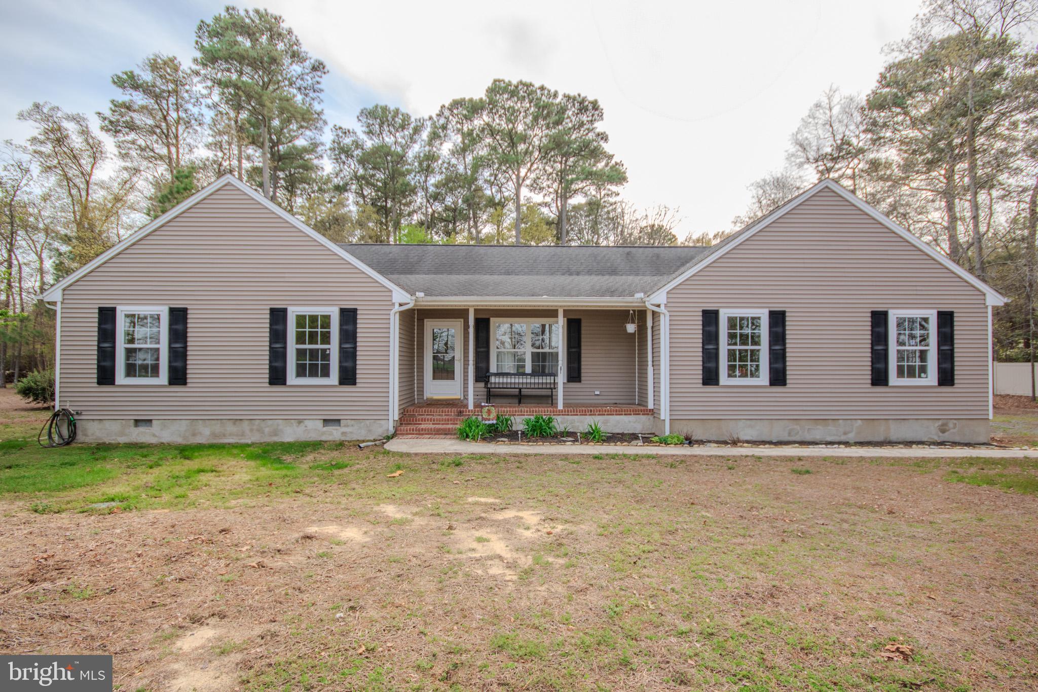 Welcome to this charming 3 bedroom 2 bathroom home nestled on a picturesque 2 acre lot in Mardela Springs. This property boasts a perfect blend of cleared and wooded areas, providing both open space and natural privacy. Inside, you'll find a sunroom with brand new flooring and an updated HVAC system to ensure comfort year-round. The kitchen has been freshly painted and features new lighting and hardware, adding a modern touch. Outside enjoy the convenience of an attached 2 car garage. Outside there is a chicken coop and additional storage shed. Recent updates include refreshed bathrooms and a freshly painted interior. Just down the road is a public boat launch on Barren Creek that feeds into the Nanticoke river. Don't miss the opportunity to make this lovely property your new home!