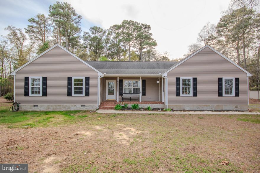 Welcome to this charming 3 bedroom 2 bathroom home nestled on a picturesque 2 acre lot in Mardela Springs.  This property boasts a perfect blend of cleared and wooded areas, providing both open space and natural privacy.  Inside, you'll find a sunroom with brand new flooring and an updated HVAC system to ensure comfort year-round.  The kitchen has been freshly painted and features new lighting and hardware, adding a modern touch.  Outside enjoy the convenience of an attached 2 car garage.  Outside there is a chicken coop and additional storage shed.  Recent updates include refreshed bathrooms and a freshly painted interior. Just down the road is a public boat launch on Barren Creek that feeds into the Nanticoke river.   Don't miss the opportunity to make this lovely property your new home!