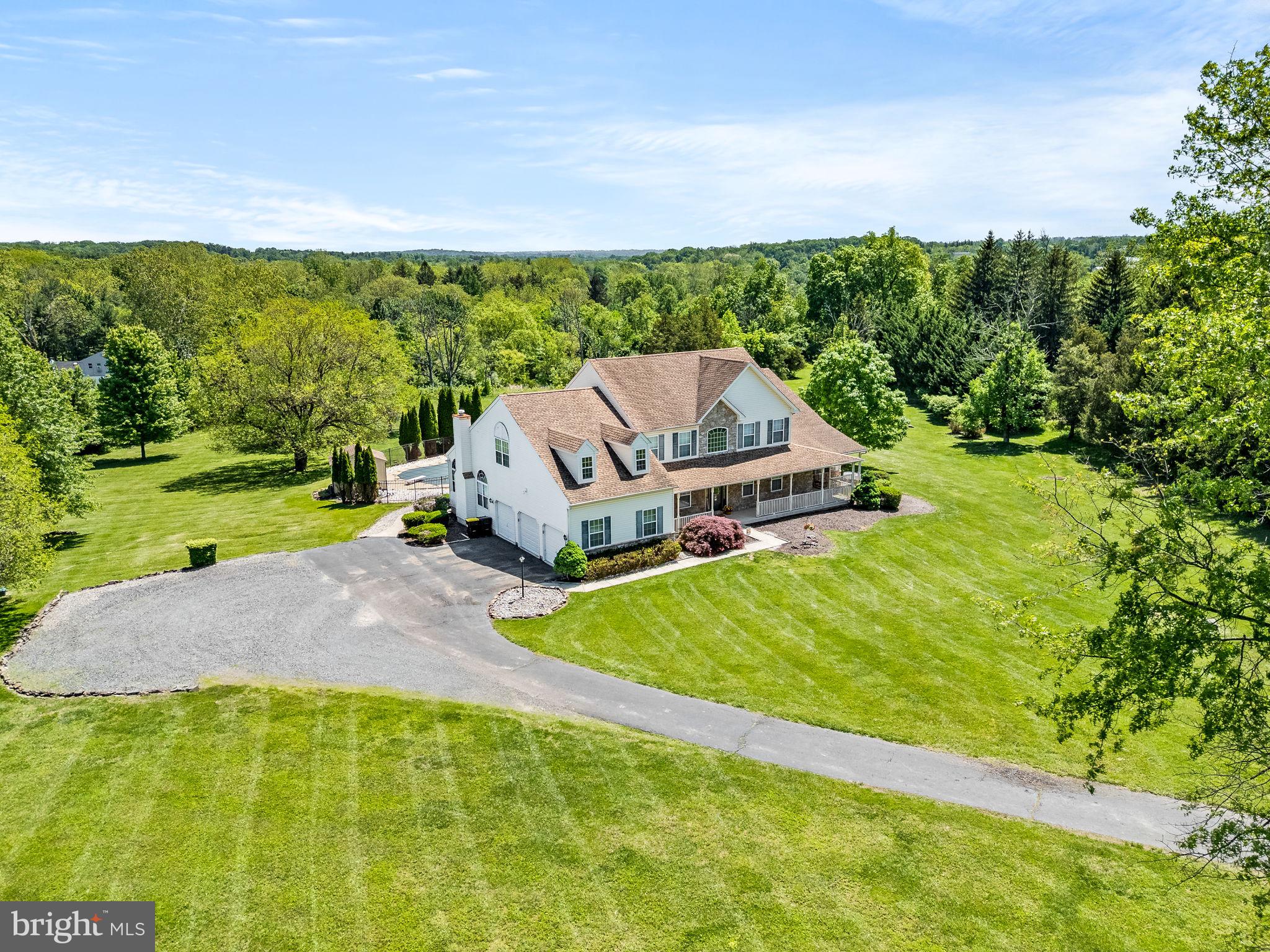 Hidden on a sprawling 4.27-acre estate, this million-dollar home offers unparalleled luxury and privacy. The gourmet kitchen is a ideal for the chef that loves to host, featuring top-of-the-line appliances and a spacious island perfect for entertaining. The master suite is a true retreat, complete with a lavish en-suite bathroom, walk-in closets, and a laundry chute. Additional amenities include a state-of-the-art home theater, and a stunning outdoor in-ground pool area (chlorine or salt) ideal for hosting gatherings. Any family members or guests looking to spend time with you can stay in their own space. As the attached in-law suite, equipped with a full kitchen and bathroom will give them their own space. This property combines elegance and comfort, making it the perfect sanctuary for those seeking an upscale lifestyle in a highly sought after town. Also comes with whole house generator.