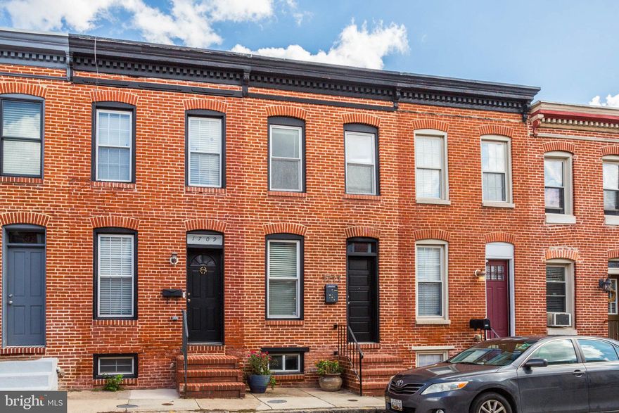 Live the charmed lifestyle in popular Fed Hill with updates galore!

Welcome to your new home in the heart of Federal Hill, Baltimore! This charming row house boasts two bedrooms, one bath, and has been many updates & upgrades to offer modern comfort while preserving its historic character. As you step inside the freshly painted home, you're greeted by a warm and inviting atmosphere. The open floor plan seamlessly connects the living and dining areas, creating a perfect space for entertaining friends or enjoying cozy evenings. Retreat upstairs to two bedrooms which are generously sized, providing a comfortable retreat for rest and relaxation or use one as work/flex space, the choice is yours. The gorgeously renovated bathroom combines style and convenience, offering a spa-like experience at home. A true gem of this property is the roof deck, a private oasis with panoramic views of the city skyline. Imagine sipping your morning coffee or hosting gatherings while enjoying the breathtaking vistas of Charm City. A dedicated parking pad with space for 2 cars ensures that you always have a place to park.  Located in the vibrant neighborhood of Federal Hill, you'll have easy access to local shops, restaurants, and attractions.  

This is a don't miss the opportunity to make this charming home your own!