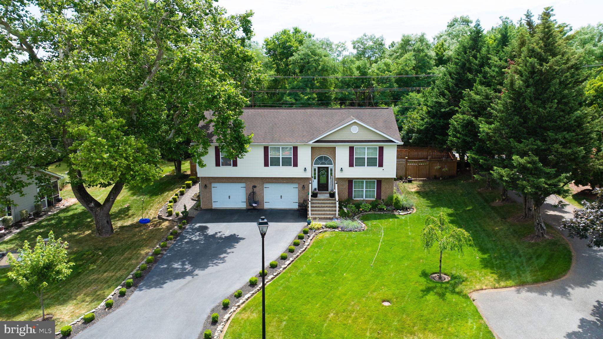 Welcome to your dream home! This stunning 3-bedroom, 2-bathroom residence offers an open floor plan perfect for modern living and entertaining. The upgraded kitchen features top-of-the-line stainless steel appliances, granite countertops, and ample cabinet space. Step outside to the oversized rear deck, an ideal spot for outdoor dining and relaxation, overlooking a beautifully landscaped yard with a rear privacy fence for your peace and tranquility. The home boasts an oversized 2-car garage, providing plenty of storage and parking space. The partially finished basement offers additional living space, including an office and a potential 4th bedroom or family room, perfect for guests or a growing family. Located just minutes from Rosemont Elementary, shopping centers, and a variety of restaurants, this home combines convenience with comfort. Don’t miss the opportunity to make this incredible property yours!