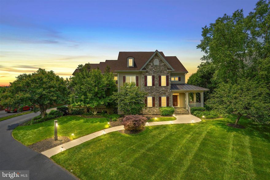 Exceptional Estate Home located in Wild Meadow,  Ashburn Farm’s Best-Kept Secret! Welcome to a truly one-of-a-kind estate nestled in the highly sought-after Wild Meadow enclave of Ashburn Farm. Rarely do homes of this caliber become available in this exclusive neighborhood. This is your chance to own a spectacular property in one of Ashburn’s most coveted communities.   Boasting over 6,100 square feet across three finished levels, this 6-bedroom, 5.5-bathroom home is perfectly positioned on a beautifully manicured, nearly one-acre lot. Surrounded by mature trees and offering a fully fenced rear yard, this property provides breathtaking sunset views and an unparalleled sense of privacy. Exceptional outdoor living designed for year round enjoyment from the heated gunite pool, hot tub and expansive patio to the screened-in porch and composite deck. It encompasses it all to create the ultimate outdoor retreat. Whether relaxing solo or entertaining your friends and family, this backyard paradise is sure to please.  Step inside from the inviting  covered front porch and you'll be immediately impressed by newly installed hardwood floors, custom trim work, fresh paint  and a thoughtfully designed layout. There is so much to love on the main level including recent remodeling to include a  bedroom and full bath making it ideal for a guest suite, nanny quarters, or primary suite option.   Host memorable gatherings in the formal dining room and unwind in the cozy living room or the expansive family room  featuring a gas fireplace and built-ins. The gourmet kitchen is a true showstopper beautifully complete with Granite countertops, subway tile backsplash, Farmhouse sink, center island with prep sink and seating, GE Monogram gas range with center grill, range hood with warming tray, warming drawer, built-in coffee station, and desk area.  Once you've embraced all that the main level offers, take a walk upstairs where you'll find the wide hallways enhance the airy feel. The primary suite is a sanctuary unto itself, complete with a spacious sitting area, two walk-in closets, a private dressing area and an elegant ensuite bathroom.  Also on this level are three additional well sized bedrooms, two full bathrooms, a sunlit open home office with built-ins and a conveniently located laundry room. The daylit lower level of the walk-out basement offers two large recreation areas, a private guest suite with ensuite bath, direct access to the backyard and patio, as well as abundant storage space.
Enjoy all the Ashburn Farm amenities including pools, playgrounds and community events.  Direct access to the W&OD Trail (take the trail/path all the way to Washington, D.C. or Downtown Purcellville).
Located just minutes to the Silver Line Metro, major commuter routes, shops, restaurants  and top-rated Loudoun County schools in a highly sought-after Stone Bridge pyramid.
This exceptional estate blends timeless design with modern amenities, offering both comfort and luxury in a premier location.  Don't miss your chance to own this dream home. Schedule your private tour today!