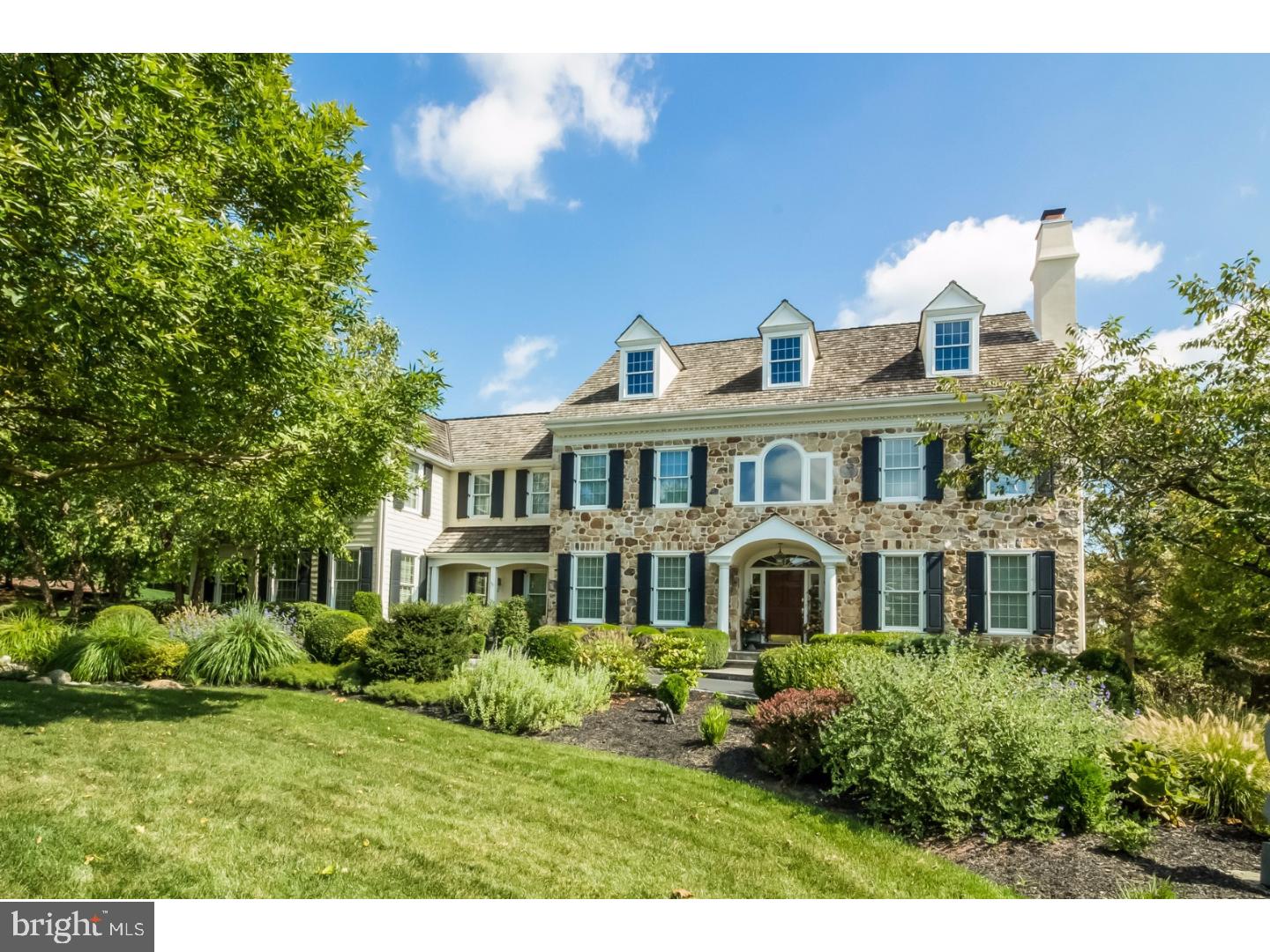 The ultimate in luxury and design, this exquisite manor home is in the sought-after community of Saybrook, in the heart of Berwyn. Designed by McIntyre Capron Architects and built by Bentley homes, this impeccably decorated 5 bedroom, 3.3 bath home features elegant architectural details and exceptional finishes. Approach the circular driveway and walk along the flagstone path to enter through the solid mahoghany front door into the gracious two-story foyer with dramatic curved staircase. The expansive front-to-back center hall opens to the formal living room and dining room. This special home showcases gleaming, wide oak hardwood floors, wainscoting, substantial mouldings, and two fireplaces. A gourmet chef's Kitchen, features a 6 burner Wolf range, Wolf double ovens, Sub-Zero refrigerator and freezer and oversized granite island. Adjacent to the kitchen is a morning room which unfolds to a sun-filled Great room with vaulted ceiling, floor to ceiling atrium window, custom cabinetry and fieldstone fireplace. Butler's pantry with wine refrigerator, Library with cherry floor inset, wainscoting with raised panels complete the first floor. Highlighting the second floor of the home is the Master bedroom suite with separate sitting room, his and hers walk-in closets, and sumptuous master bathroom. You'll also find four additional bedrooms, 2 full baths, large laundry room and rear stairway with skylight to the kitchen. An open staircase leads to a finished, day-lit, walk-out lower level with multiple windows, temperature controlled wine cellar, media room and entertaining space. There is also a large, unfinished area for plenty of storage. Tree-lined rear property with elegant flagstone patio provides the perfect setting for outdoor gatherings. Other highlights include extensive landscaping and perennial gardens, in-ground illumination lighting, whole house Generator and lawn and garden irrigation system.