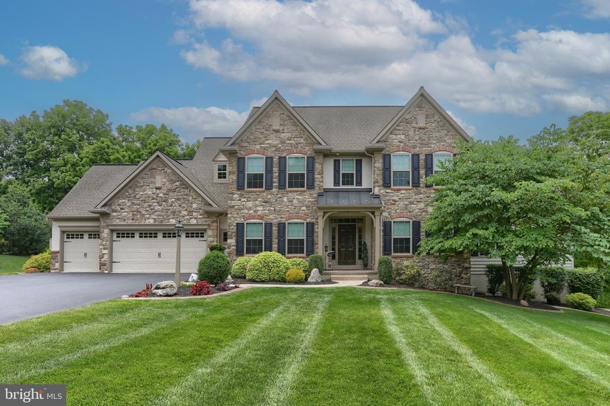 Experience luxury living in this meticulously designed custom home, offering 4 generously sized bedrooms, 3.5 bathrooms, and a  finished lower level ideal for entertaining. This home is filled with thoughtful, custom features throughout, including a spacious three-car garage for added convenience.

Step outside to your own private backyard retreat, complete with a sparkling in-ground pool and beautifully crafted hardscaping—perfect for relaxing or entertaining.

The living room showcases soaring vaulted ceilings, a cozy gas fireplace, and skylights that bathe the space in natural light. The formal dining room exudes warmth and elegance, blending rustic and modern elements with its striking coffered ceiling, custom stone accent wall, and board and batten detailing. Expansive windows enhance the space, filling it with brightness and charm.

Nestled on 1.7 acres and surrounded by mature landscaping, this stunning property offers both privacy and a serene natural setting.