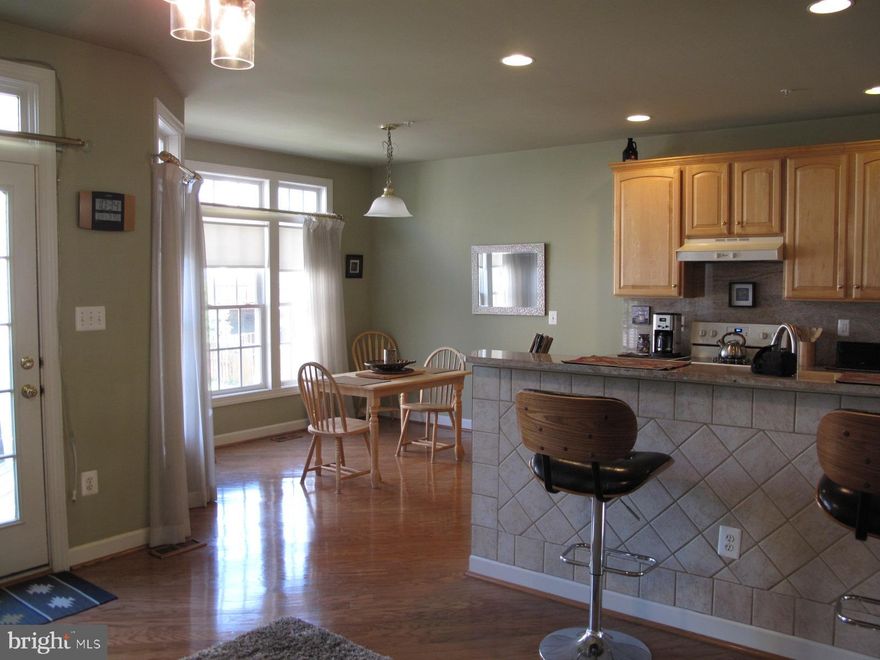 This beautifully maintained home offers spacious rooms with bumpouts on all three levels.  Island kitchen includes tall maple cabinets and granite counters,  and overlooks breakfast area and family room.  Hardwoods extend throughout main level. Large primary bedroom has plenty of closet space plus adjacent bath with walk-in shower and separate tub. Two more roomy bedrooms share a hall bath. The gas fireplace surrounded by built-in bookshelves is the highlight of the downstairs rec room.  A flagstone patio in the fenced yard can be accessed from the rec room, Trex deck is off the kitchen.  Great location -- community pool is up the street; MARC train station a quick drive away; shopping, soccerplex, public parks all nearby! Available AUG 1.  All applicants over 18 must apply online through RentSpree and provide 2 most recent paystubs. No pets. GCAAR lease will be used, Housing Choice Vouchers welcome