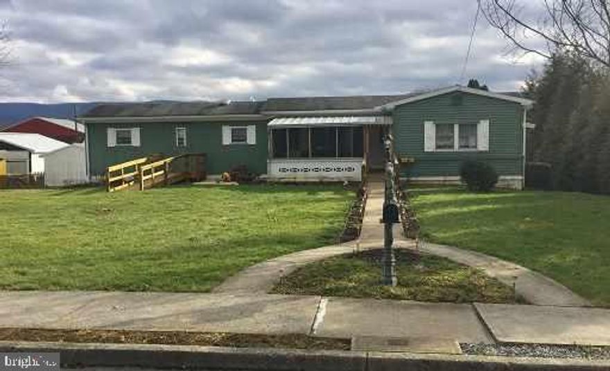 This well maintained two bedroom is cozy & move-in ready.  Mobile home w/addition & full basement.  Central air, oil/gas heat & detached garage on large lot.  Zoning is R-2 Residential. Financing available from Kish Bank with 20% down, up to 15 years.
