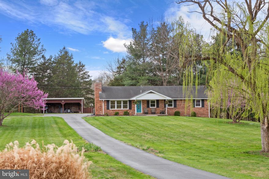 Just outside the historic charm of New Market, this 4.5-acre property captures the essence of Shenandoah Valley living. Wake up to breathtaking eastern sunrise views stretching across Massanutten Mountain, with the gentle setting bordering Smith Creek with Shenvalee Golf Course across the creek. This classic brick home offers a warm and inviting layout, featuring an open kitchen with dining space perfect for gathering, and a spacious living room anchored by a cozy gas fireplace. Downstairs, a partially finished full basement provides additional living space for a family room, home office, hobbies, or entertaining—plus generous storage. Step outside and you’ll find room to truly live—garden, play, relax, and take in the quiet beauty of your surroundings. All of this, just minutes from I-81 and Route 11, with easy access to a community park and pool, local shops, dining, caverns, and beloved Shenandoah Valley festivals. Whether you're looking for a full-time residence or a peaceful retreat, this property offers the best of both worlds - privacy and connection.