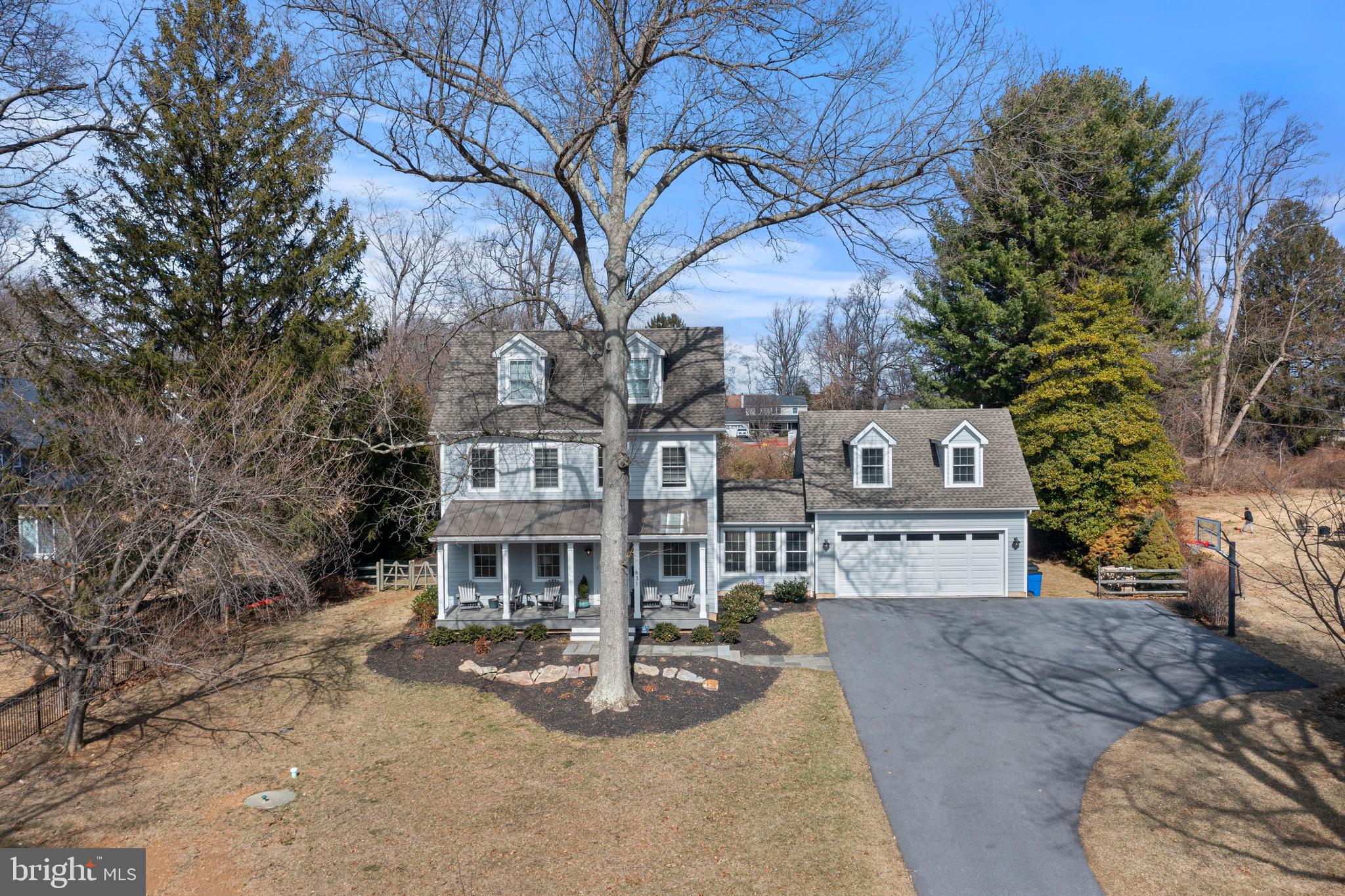 Welcome to Malvern Borough and this classic colonial home with elegant farmhouse influences sitting upon approximately 6/10 of an acre. Your home greets you with an inviting covered front porch that is sure to be a favorite spot in the warm months for sitting and watching the world go by. This home features 4 / 5 bedrooms, three full baths and one half bath. From the moment you enter this home, it greets you with a warm hug. Nine foot ceilings, dark hand scraped hardwood floors, and warm paint tones throughout. The first floor features an open concept that will keep the party connected with great room, eat-in kitchen area with fireplace and kitchen. Just off the kitchen through the sliding doors, is a covered back patio with fireplace and kitchenette area for grilling. The back patio will definitely be a hot spot for watching fall football games. The kitchen features a commercial grade eight burner range, with stainless steel appliances and farmhouse sink. Classic subway tile backsplash taken to the ceiling provides function and a high end detail to the hub of the home. The island is sure to be the center of any party. Off the main hallway is a butlers pantry with copper counters and backsplash that leads to the breezeway / mudroom area and provides access to the two car garage. The breezeway also provides access above the garage where there is a fifth bedroom with full bath that can be used as a home office, in-law or au pair suite.
The second floor of the home features three bedrooms and two full baths. The main bedroom features a four piece bath with dual vanities and walk-in closet featuring built in closet organization. Bedrooms two and three are also located on this floor and share a hall bath. The third floor features a fourth bedroom that is sure to cause an argument as to who gets this gem of a room with spacious ceiling heights, hardwood flooring and two dormers that flood the room with south facing light.
This home provides easy walkability to Malvern Borough shops, restaurants and parks. Across the street are Chester Valley baseball fields, Malvern tennis courts, playground and covered pavilion for parties in the park. Come July, Monument park turns into the annual Fire Department Carnival for a week with rides and games and ends with town fireworks display. There are two parks that provide outdoor basketball courts. Our main park features a pavilion that hosts weekend farmers market and our annual tree lighting ceremony to kick off the holiday season. Our town hall features our Police department and public library. You will enjoy easy access to the R-5 train (Main Line). Malvern is truly a Village unlike any other along the Main Line, providing a strong sense of community via little league baseball, Great Valley Community organization basketball league, cheer and football and award winning schools that support music and the arts. Great Valley Marching band has won the state competition 3 years in a row. Malvern provides quick access to horse country several private golf clubs as well as private schools if desired. Malvern Borough is not only a great place to live, it's a lifestyle.