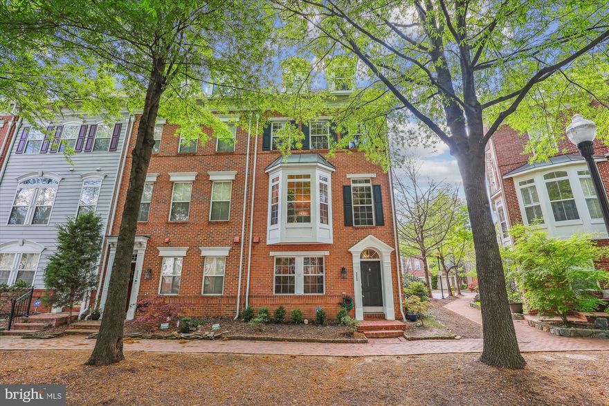 Beautifully updated end-unit townhome in the sought after community of Cameron Station. Four levels  of modern luxury  adorn this Alexander model featuring three bedrooms and three full and one half baths plus den.  Upgrades galore including hardwood floors throughout, custom closets and built-ins, crown moldings, updated kitchen, bathrooms and lighting. Step into the foyer and to the left you'll find the spacious wine celler  a unique feature that is perfect for any enthusiast. On the  main level you'll find  spacious living and dining rooms with a bay window overlooking the tree-lined street. The gourmet kitchen has a gas stove, granite countertops, new stainless steel appliances, marble backsplash and a 7-foot center island. The sun-filled breakfast and family rooms with the gas fireplace open to the patio – perfect for family gatherings and entertainment! The second level features the primary bedroom suite with vaulted ceilings and updated spa like bath with a Jacuzzi soaking tub. The third bedroom, the hall bath and the laundry area complete this level. The loft on the upper level is the ultimate guest retreat with its Palladian windows, vaulted ceilings, full bath and a walk-in closet, offering an added privacy.  Don't miss the 2 car garage, fully finished with gleaming epoxy floors and custom built storage shelving.  Enjoy all the amenities Cameron Station has to offer: outdoor pool, fitness center, bike/walking paths, tennis courts, picnic areas, shuttle to Van Dorn metro, and resort-like landscaping. Great location! Walk to the Alexandria library, Ben Brenman park, plenty of shopping and dining options or drive to Old Town and DC within minutes. You're going to love living here!