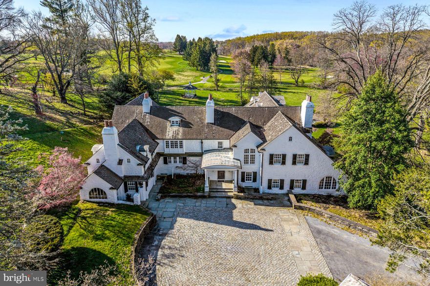 Capture this rare opportunity to be the next lucky stewards of this iconic Radnor Hunt Jewel. Set on a breathtaking 15.7 acre lot, down a long tree-lined driveway, this stunning stone residence, 2 guest houses, 5-stall horse barn, greenhouse, spacious garage, heated pool and pool house, offer every ingredient for gracious country living at its best. The original 1700's farmhouse has been thoughtfully restored and expanded by John Milner and Cullen Construction over the years and includes wonderfully open living and entertaining spaces, incorporating the sun-filled interior rooms with the ancillary buildings and private grounds. Endless features include a charming front to back foyer with original beams, 7 fireplaces, beautifully restored and replicated wide plank oak floors, beautiful living and dining rooms scaled to host large gatherings, a cozy bar room, rich study and expansive great room looking out over the expansive lawn, pool and gardens, country kitchen opening up to a convenient butler's pantry and bright breakfast room/ conservatory, second floor primary suite with sitting room, large walk-in dressing room, his and hers marble bathrooms and spacious bedroom, 5 additional bedrooms with en-suite baths including a private3-room au-pair suite and guest suite off of the second staircase, partially finished lower level with a true chef's kitchen, enormous wine cellar, entertaining room and more. Enjoy this priceless, oasis-like setting while being within a short ride on the surrounding riding trails to Radnor Hunt and just minutes from renowned schools, endless golf courses and recreational opportunities, fabulous restaurants, shopping and all forms of transportation. Owned by the same family for almost 40 years, this one-of-a-kind treasure is not to be missed!