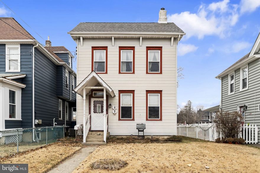 Welcome to 52 Green Street, an inviting, well-appointed single-family home highlighted by a charming covered front porch. Offering 1,686 square feet of beautifully flowing living space, this 2-bedroom, 2-full-bath home blends timeless charm with thoughtful modern upgrades. Step inside to a sun-filled living room where warm laminate flooring sets the tone for comfort and elegance. The space flows seamlessly into a separate formal dining room, creating an ideal setting for hosting holiday gatherings, dinner parties, or intimate meals. The eat-in kitchen serves as the heart of the home, offering ample space for everyday living and entertaining. Both bathrooms have been tastefully upgraded, each offering its own retreat. The main-level full bathroom features a sleek walk-in shower and conveniently includes the laundry area, combining style with everyday functionality. Upstairs, you’ll find two generously sized bedrooms, including a private en-suite bathroom featuring a classic clawfoot soaking tub, creating a spa-like escape. This level also offers access to a spacious finished attic bonus space, ideal for use as an additional bedroom, home office, creative studio, or flexible living area. Step outside to a fully fenced backyard oasis,  perfect for entertaining, pets, or quiet relaxation. Enjoy outdoor living on the rear deck while the shed with electric provides exceptional versatility—ideal for a workshop, hobby space, or additional storage. Ideally located just minutes from Route 1, I-295, PA/NJ bridges, shopping, dining, parks, and public transportation, this exceptional home offers the perfect balance of neighborhood charm and commuter convenience. Additional interior photos coming soon! Don’t miss this rare opportunity, make this home yours today.