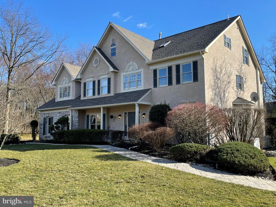 Magnificent & meticulously maintained property located in the very desirable Trewellyn Estates in Lower Gwynedd.  One of two builder model homes located just inside the main entrance.  With approximately 5926 square feet of living space there’s ample room for everyone to have their own space or to gather.  This home is “over-the-top” in upgrades & improvements.  New roof (2022) with transferable 30-year warranty & 3 new garage doors (2023).  An exterior generator provides ample backup power for appliances, lighting, & pool mechanicals.  A lovely stone enhanced façade leads into a gracious 2 story foyer with newer hardwood floors, dry bar, & overhead bridge with one-of-a-kind Asian antique door rails.  To the left a formal dining room with raised wall panel moldings & butler pantry.  To the right a formal living room accented with chair & crown moldings. Through the foyer there is a tiled ½ bath/powder room &  well-appointed office complete with bay window & French doors.  Passing under the bridge you experience the “wow” of open living space to include a 2-story grand room, gourmet kitchen, & breakfast area; all with a magnificent private view overlooking the backyard landscaping & in-ground pool area.  The grand room contains a 2-story wood burning stone fireplace & custom-built wall unit.  The gourmet Texas sized kitchen has been bumped-out & updated with granite countertops, cabinetry, & separate island for grilling & entertaining in addition to a large center granite island & breakfast room area with custom & heated tiled floor. Updated high-end stainless-steel appliances throughout; gas cooktop, over/under oven, microwave; grill station includes top-of-the-line hibachi, 2-burner gas stove, hot plate, & commercial exhaust system.  The mud & laundry room is adjacent to kitchen with access to 3-bay garage. The back staircase leads to the second level which welcomes you to 4 of the 5 bedrooms; each with a full bath.  The Master Bedroom area contains a large suite, fully renovated custom granite bathroom including an additional bidet toilet, heated tile floor, sitting room & two over-sized walk-in closets. 3 of the 4 remaining bathrooms have been completely renovated & include custom tiling with accents.  The upper level contains the 5th bedroom & fully customized full bath.  Most of this level is “open design” offering plenty of solitude.  Natural light cascades through several sky lights, windows, & front gable.  Currently used as a reading, office, TV, and gaming area with an additional room for storage.  A fully finished basement with “open design” offers abundance of usable space, custom built-in's, gas fireplace & waterwall feature.   Currently used as a recreation room, second office, game room, & gym.  This level has plenty of separate storage space & a custom wet bar (complete with dishwasher, beverage cooler, granite tops & sink).  There is a full indoor spa with dry sauna (seats up to 4), steam room, & full bathroom (custom tiled) to relax after a long day.   Access to this level is through an inside staircase or separate French doors leading outside.  The front yard faces a beautifully landscaped community circle. The backyard is breathtaking with mature landscaping (including decorative boulders & rocks), garden seating areas, a gorgeous concrete in-ground swimming pool & spa (both UV filtered) enclosed with wrought iron style fencing, multiple tiers of decking, patios, & walkways for the ultimate place to entertain.  Separate sheds for pool mechanicals & workshop/storage.  A back yard paradise!   This majestic home is situated on a .88 acre partially wooded lot (surrounded by protected wetlands prohibiting future development) and setback on a cul-de-sac location offering complete privacy.  Award winning Wissahickon School District, near excellent private schools & minutes away from terrific restaurants & shopping.  Close to the network of Lower Gwynedd Trails.  Call for an appointment today!