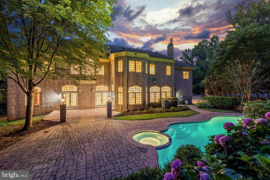 Exquisite custom built all brick home on a beautiful landscaped gated lot with a resort style heated pool and waterfalls * This home makes a statement in presentation and features six bedrooms, 5 full baths and three half baths and 7 gas fireplaces * Large Portico entrance * Huge entrance foyer with sweeping stairs * Twelve foot ceilings on the main level * Spacious open floor plan with a Great Room perfect for large scale entertaining * Paneled library with fireplace and walls of windows and wet bar with refreshment frig and sink * Updated kitchen with quartz countertops, center island with eat up breakfast bar with adjoining family room with walls of windows overlooking pool and expansive patio * Appliances include Thermador stove and oven, Subzero refrigerator, Miele dishwasher * Back stairs to upper and lower levels * Large walk-in pantry * Mudroom and Laundry * Oversized three car sideload garage * Upper level has a luxury owners owners suite with hardwood floors, fireplace, large spa style marble bathroom, two oversized his and her closets and a kitchenette * Four additional secondary bedrooms (two en suites and two Jack and Jill) on the upper level with walk-in closets * All closets have professional organization systems * Second Laundry Room on Upper Level * Lower level has all engineered hardwood except for Media Room, large bar area with full kitchen including stove, microwave, dishwasher, two sinks and refrigerator * Yoga Room * Mirrored exercise room * Six bedroom with attached bath * Expansive recreation room with two gas fireplaces and a half bath *
House generator *• Over $150,000 in improvements in 2021! *