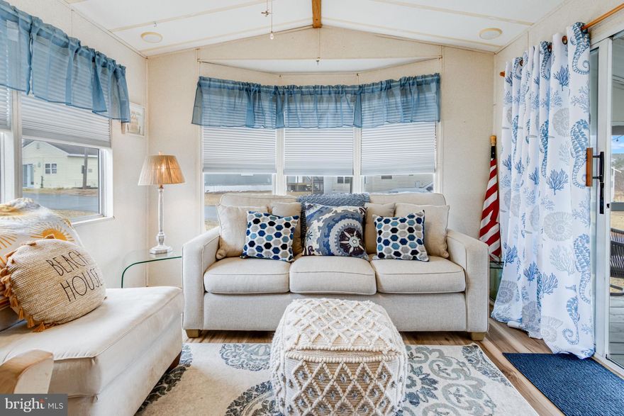 CUTE AS A BUTTON! This little beach getaway is truly TURN-KEY and MOVE-IN READY! Being sold furnished and completely ready for its new owners, this is your chance to enjoy your very own happy place at the beach! Situated off of Route 24, this adorable 1+ bedroom, 1 bath mobile home features a vaulted living area, an oversized screened porch including a small deck, and so much more! Recently updated with new LVP flooring and blinds, you’ll stay nice and cool with the home’s multiple ceiling fans and a new Toshiba AC floor unit. A new water heater was also recently installed in 2024. With a separate bunk bed area with two bunks, the home sleeps 4 – just what you need after a long summer day at the beach! Situated in a seasonal park, you can enjoy this home from April 1st to November 30th with a low yearly lot lease fee of only $2,600, which includes water and trash removal! The best part? Lot rent is paid through August 1, 2026, and is included in the sale! Close to popular J.D. Shuckers, Tanger Outlets, and all that Route 1 and Downtown Rehoboth have to offer, a new stoplight is being installed at the community entrance to make exiting onto Route 24 even easier. This is the adorable coastal retreat you’ve been looking for. Just imagine relaxing on your oversized porch after a day at the beach, not a care in the world! That could be your summer when you make 20912 Daniels Way yours! Schedule your private showing today.