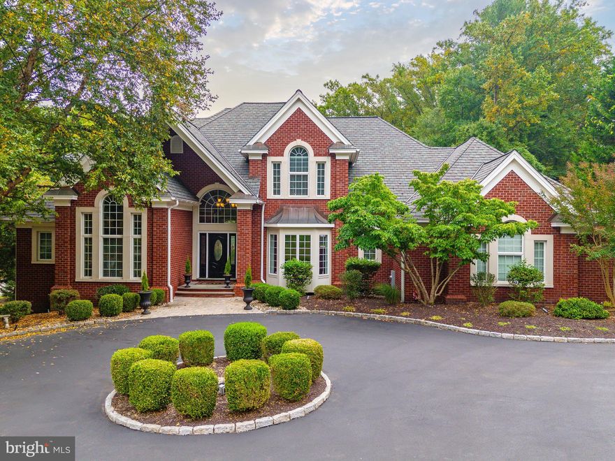 This exceptional brick home is set back on beautiful level grounds in sought after Media. Combining luxury living with state-of-the-art functionality complemented by two acres of private manicured grounds that create a serene setting. An entertainer's dream, from the fabulous open floor plan, high end finishes, radiant heated floors, custom millwork, welcoming outdoor space to the knockout lower level, it is sure to impress. Upon entry, you'll immediately notice the meticulous attention to detail and craftsmanship, beginning with the two story foyer and the sweeping staircase with wrought iron railings, elegantly complemented by custom marble floors. The living room features a gas fireplace w/ custom mantle, beautiful crown molding and an abundance of windows allowing natural light to spill through. A wet bar makes for easy entertaining. An office/custom cigar lounge room stuns with a coffered ceiling, paneled wall detail, custom cabinetry and top of the line air filtration & separate HVAC system for the ultimate experience.
The living room is open to the expanded kitchen and breakfast room perfect for entertaining.The kitchen is a chef’s dream, including a fabulous beverage center with a 100+ bottle Sub-Zero wine refrig, two Sub-Zero refrig drawers and a built-in Miele coffee station. The kitchen includes a Z-Line commercial 6 burner gas range, dual sinks, custom cabinetry, glass backsplash, and granite counters.The large island offers plenty of prep space and seats 4, abutting the sunlit breakfast room. A cozy gas fireplace, seating area and access to the expansive deck, truly make this kitchen the heart of the home. Through the butlers pantry an oversized dining room with refinished Brazilian maple floors is awaiting your guests. A laundry room with ample storage and a powder room are just off of the entrance from the 3 car heated garage that features epoxy floors, custom cabinetry, and storage. The Primary Suite is a true retreat with an oversized bedroom area complete with a gas marble fireplace, vaulted ceiling and access to the deck and hot tub overlooking the grounds.The Primary Bath is a Spa like escape with two walk in closets by Closet by Design, a private W/C, soaking tub, dual vanities, and a large frameless glass shower with multiple shower heads and body sprayers.  Up either the stunning front staircase or the convenient back stairs the second floor awaits. Bedroom 2 features a vaulted ceiling & walk-in closet and Bedroom 3 has a Juliet Balcony and walk-in closet, sharing a jack & jill bath with tub shower combo, and dual sink vanity. Bedroom 4 is a 2 room suite- a large room with the bath and walk-in closet, while two steps up is another generously sized bedroom! A wonderful space for in-laws, nanny or teenagers!  
The lower level offers an entertainer’s paradise, complete with a new state of the art theater, with seating for 8 and for 4 more at the countertop seating/bar. A billiard room and a wet bar add to the fun! There is a convenient powder room for guests. Two exercise rooms with full equipment and a sauna create the perfect home gym. A spacious daylit bedroom suite (currently an office) with full bath adds to the functionality of the space.The new tile floor and wainscoting throughout add to the luxurious space. 
Outside, overlooking the private grounds, the oversized deck offers ample space to relax and entertain, with a new top-of-the-line Jacuzzi hot tub, and sonos speaker system, perfect for relaxing after a long day. Throughout this meticulously maintained home, you’ll find new light fixtures, window coverings and more. The New high-end 4ply roof, tankless hot water heater, two new compressors and boiler for radiant floor heating, and a whole house generator, making for peace of mind! Don't miss the opportunity to own this home with unparalleled features, and a list of over 100K in luxurious Inclusions, all located minutes from the vibrant towns of Media or Newtown Square!