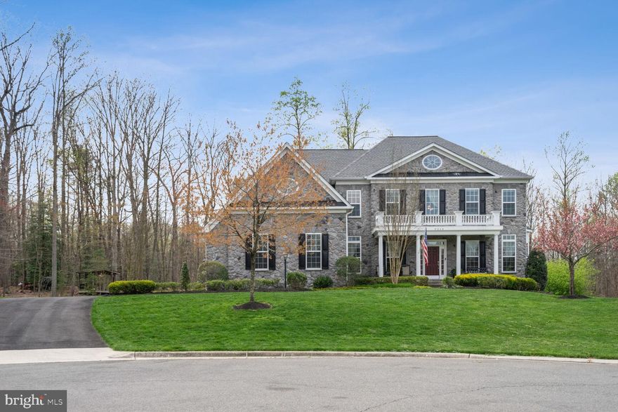 This beautifully appointed, custom Canterbury colonial is located on nearly an acre at the end of a quiet cul-de-sac and backs to the forest. The home offers 5 bedrooms, 4.5 bathrooms, a 3-car side-loading garage with loft storage and electric vehicle charging station, and over 7,100 square feet of well-thought-out living space.

The home features a bright, gourmet kitchen, a main-level and an upper-level office, a two-story family room with a stone fireplace, a sunroom, an immense primary bedroom with a sitting room, plenty of closet space, and a luxury salon primary bathroom.

The lower level walk-out basement has a recreation room, a fully equipped wet bar with refrigerator, microwave, and dishwasher, a media room, an exercise room, a fifth bedroom with a full bathroom, abundant storage space, and a workshop.

The outdoor living space includes an extensive composite deck, a huge covered porch with a fireplace, a hot tub, a screened-in porch, a private backyard, and a large 2-story, 24x14 Amish barn.