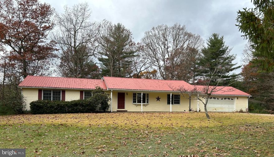 This affordable 3 BD 2BA home in a beautiful mountain setting is conveniently located 2 miles from Rt 48 (Corridor H) and minutes from SR 259.   Special features include a living room plus a great room, partial basement with walkout access, 2 car garage, large deck with pergola.  The home is located on over 7 acres & is near to many of WV's parks. Lots of room for outdoor fun in your own backyard! Don't miss out on this opportunity. Schedule an appointment today.