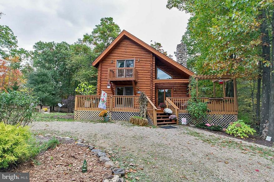 Beautiful Log Home w/ log sided addition in 2005 & mountain views.  BR & BA on all 3 levels.  Wood floors, new carpet, MBR w/ sitting area & walk in closets, separate DR, 2nd MBR (loft) w/ balcony, corian counter top, great room w/ WB fireplace, gazebo w/ hot tub, wrap around decks, stone patio, horses allowed, 3 storage sheds.  UNRESTRICTED, subj. to buyers verification.  Taxes based on 20.6 AC
